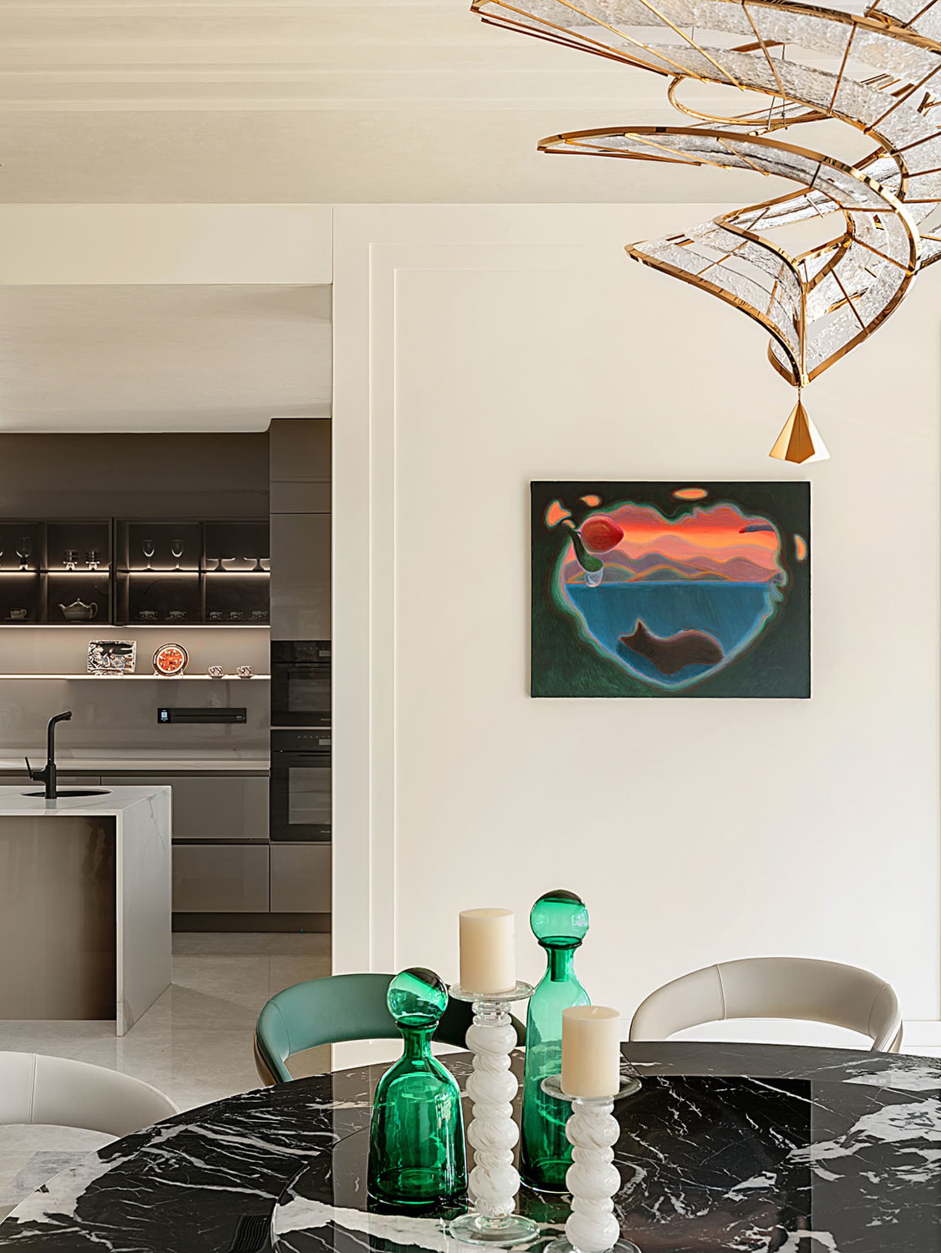 Modern kitchen with marble countertops and a minimalist design.
