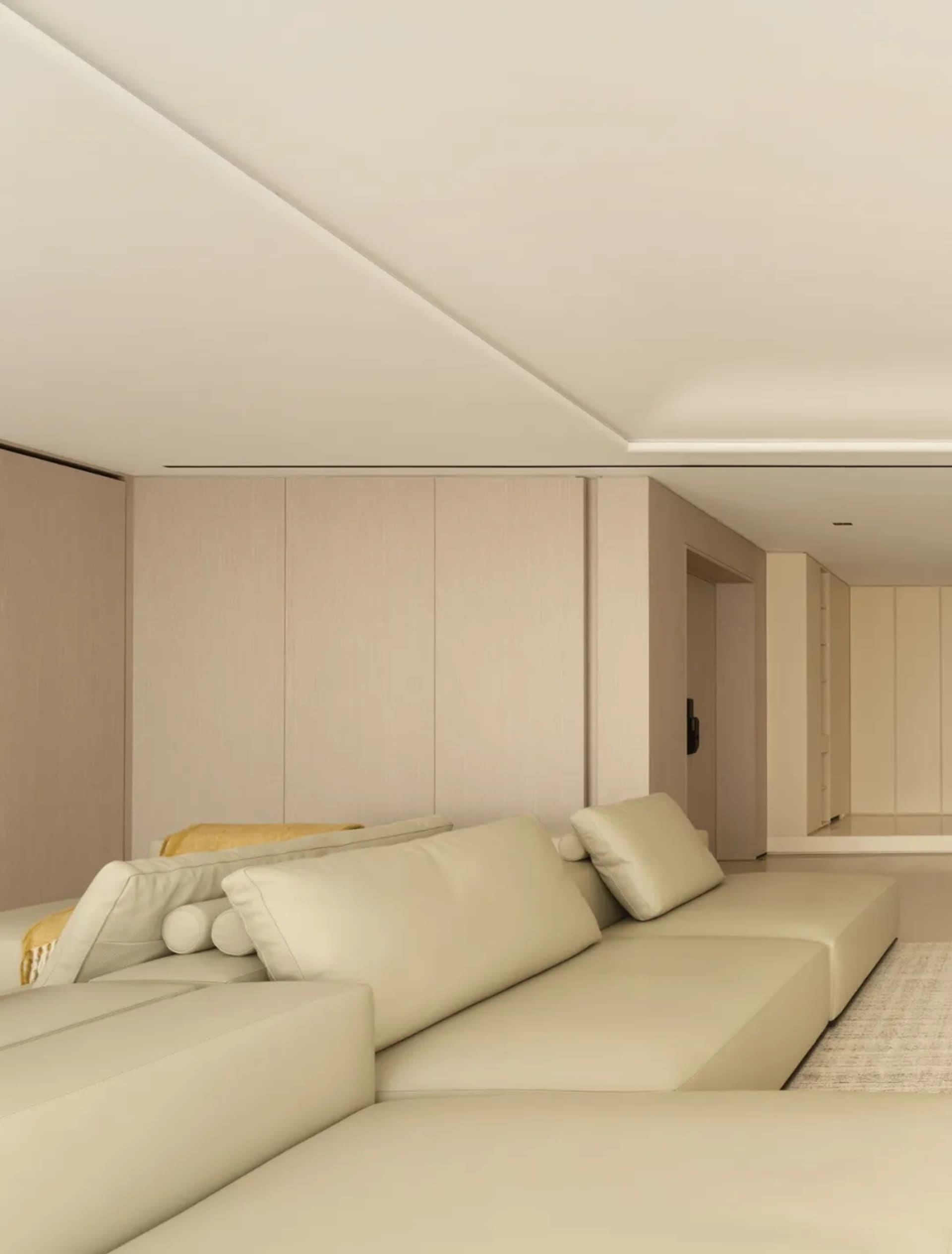 Modern living room featuring a large leather sofa.
