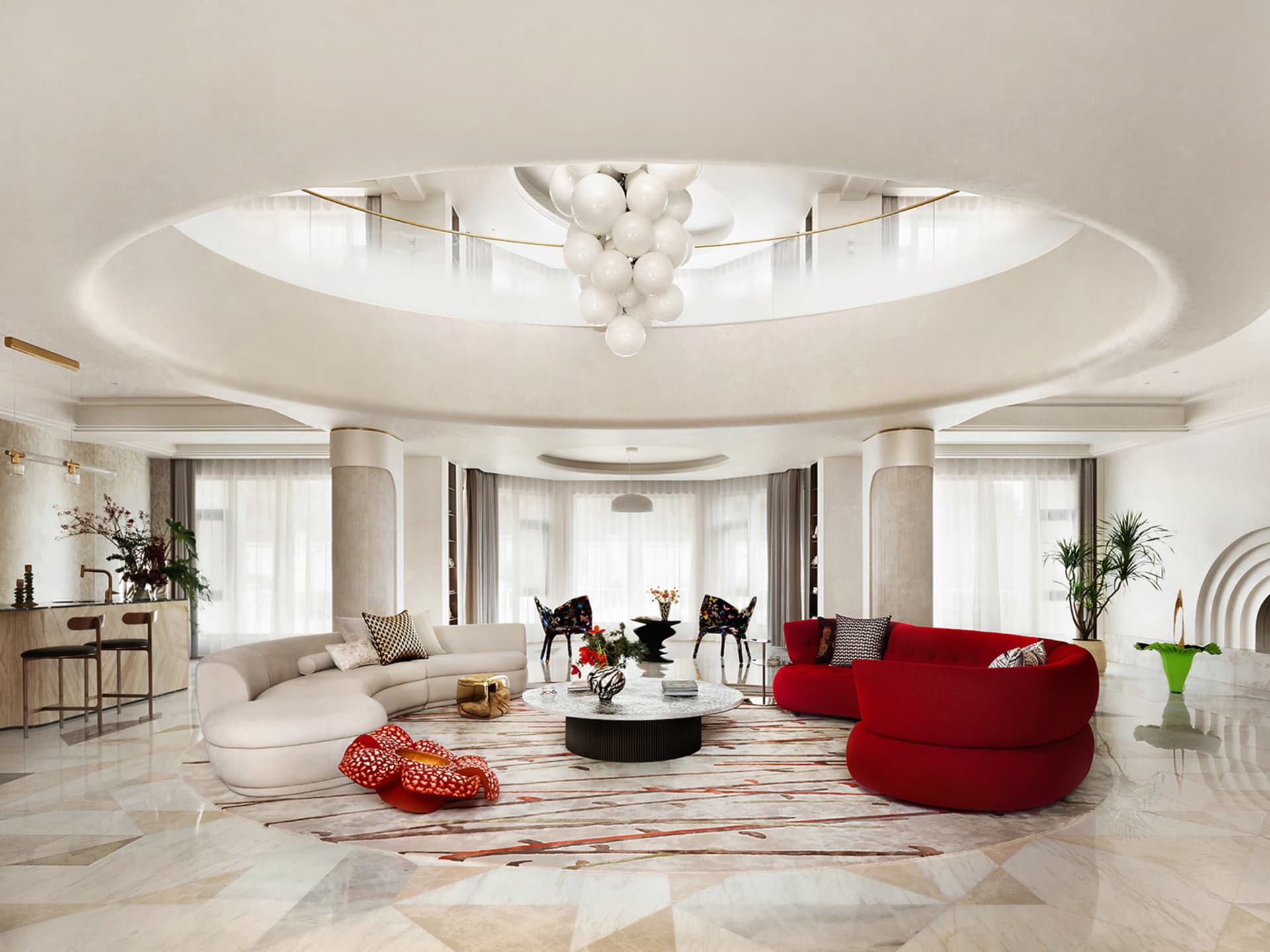 A modern living room with marble flooring, circular white sofas, and a central coffee table with decorative items.