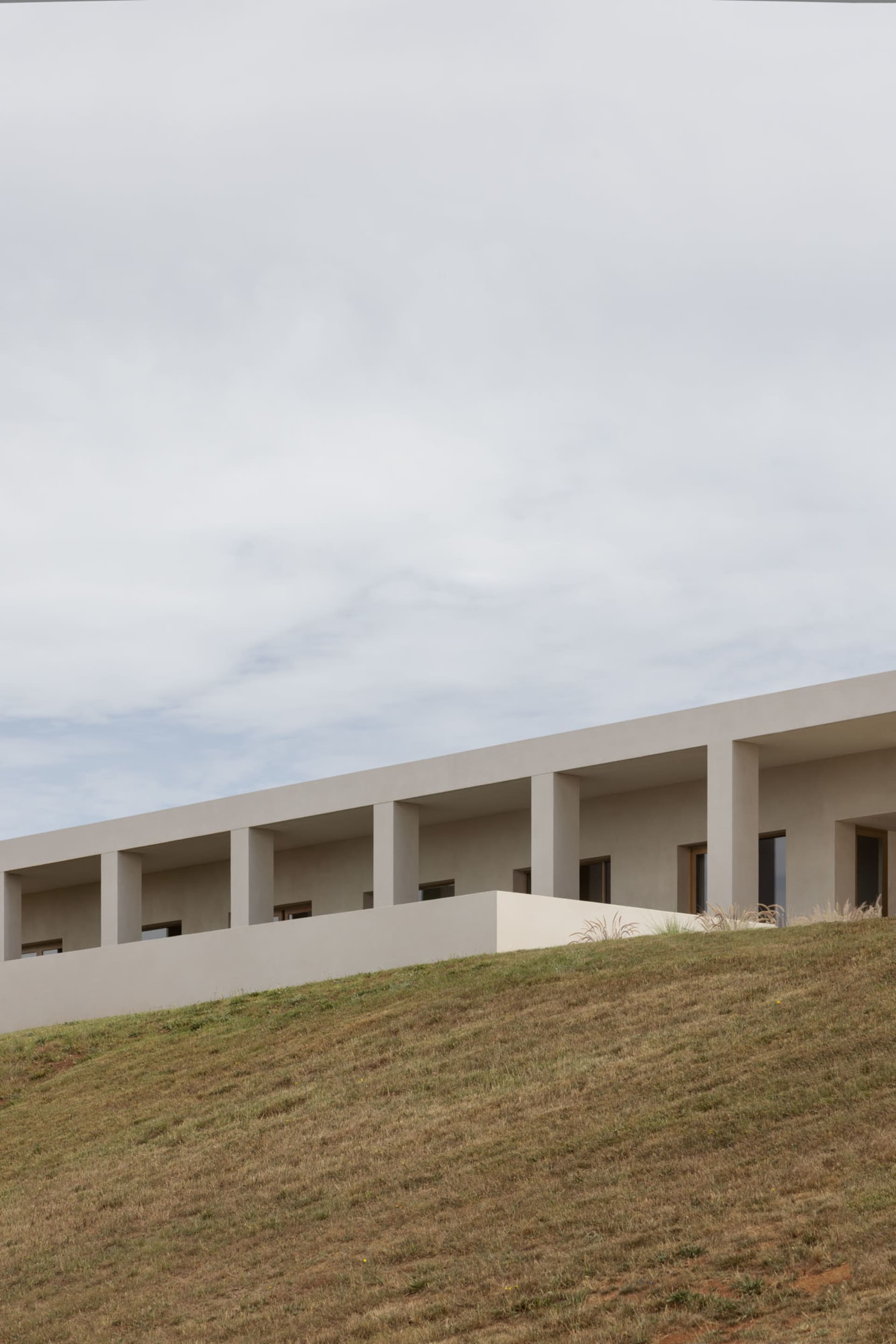 A modern architectural structure with a minimalist design, constructed of concrete.