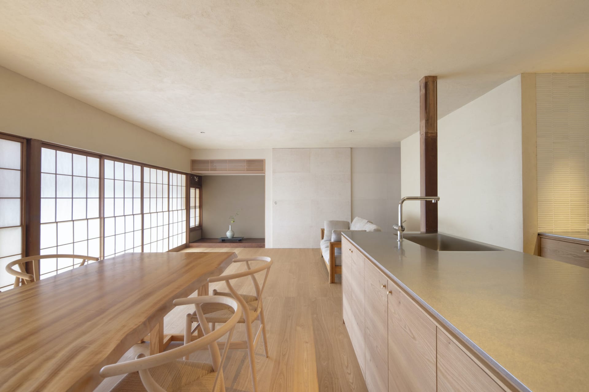 A modern residential kitchen featuring wood elements and a cozy atmosphere.
