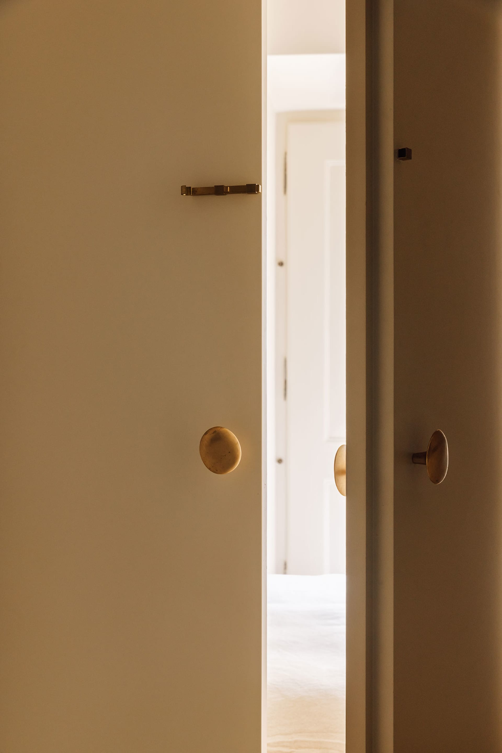 Modern minimalist interior with brass door handles