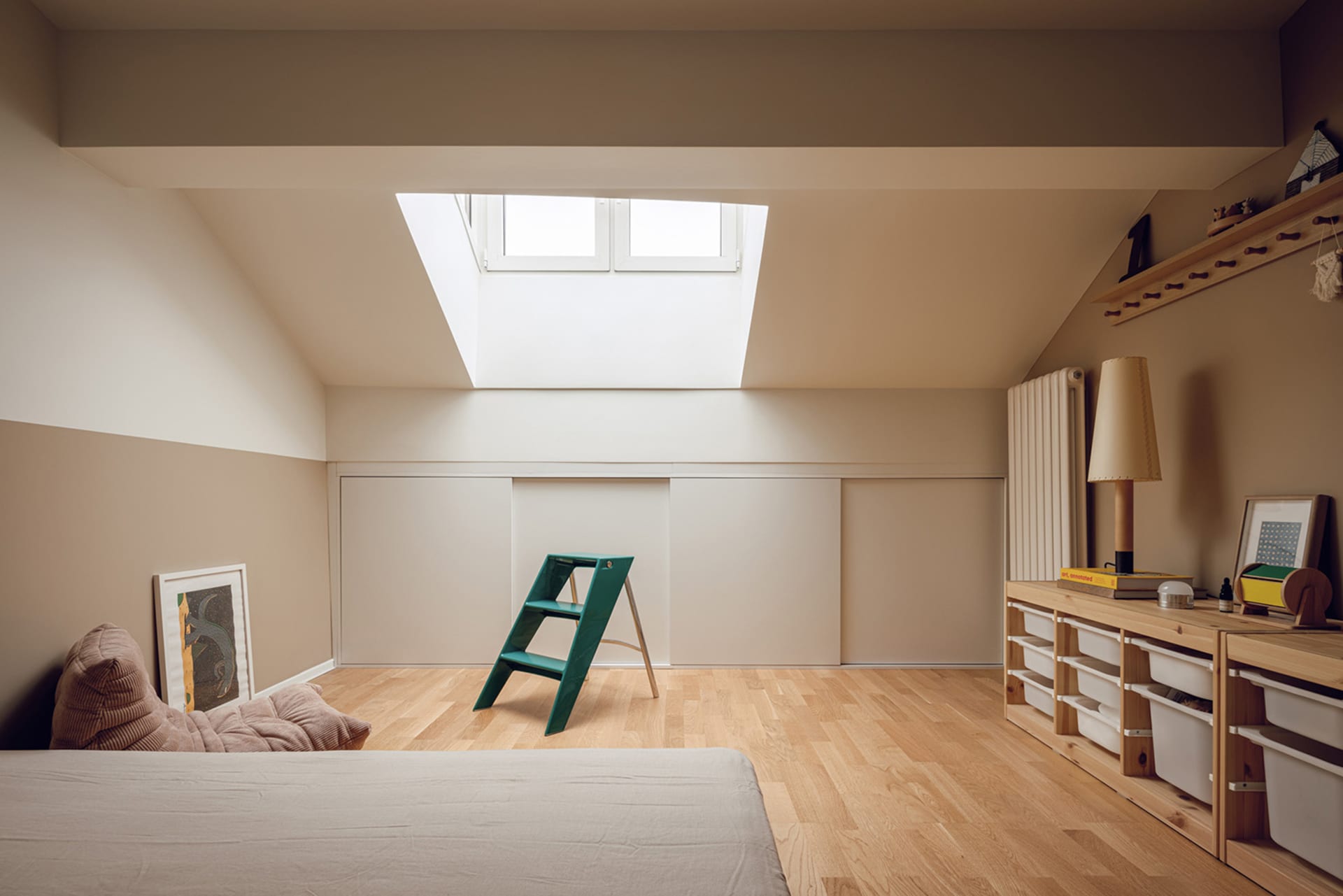 A modern bedroom with wooden furniture, including a bed, shelves, and a ladder.