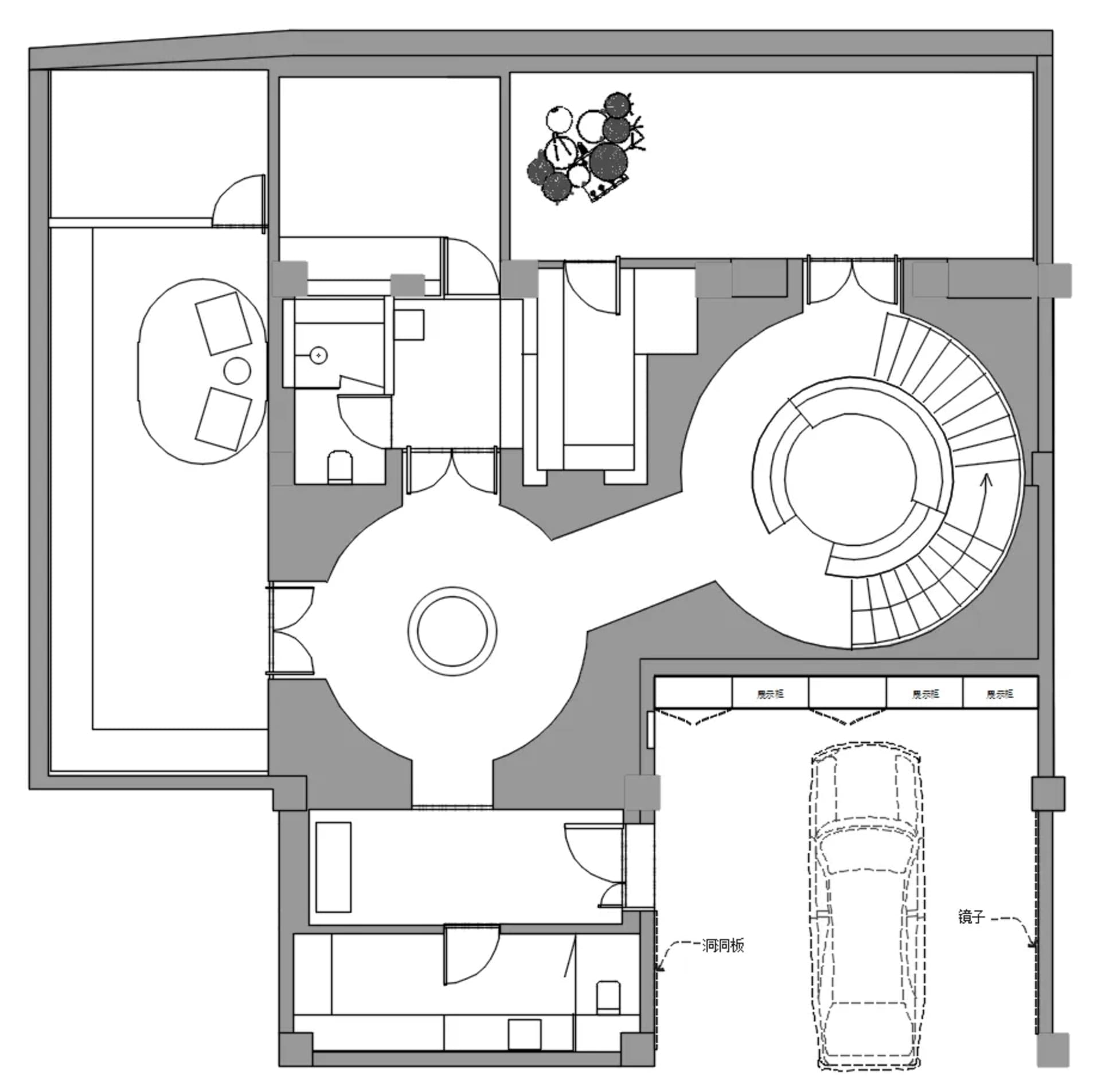 A modern architectural floor plan with a focus on open living spaces and a central circular staircase.