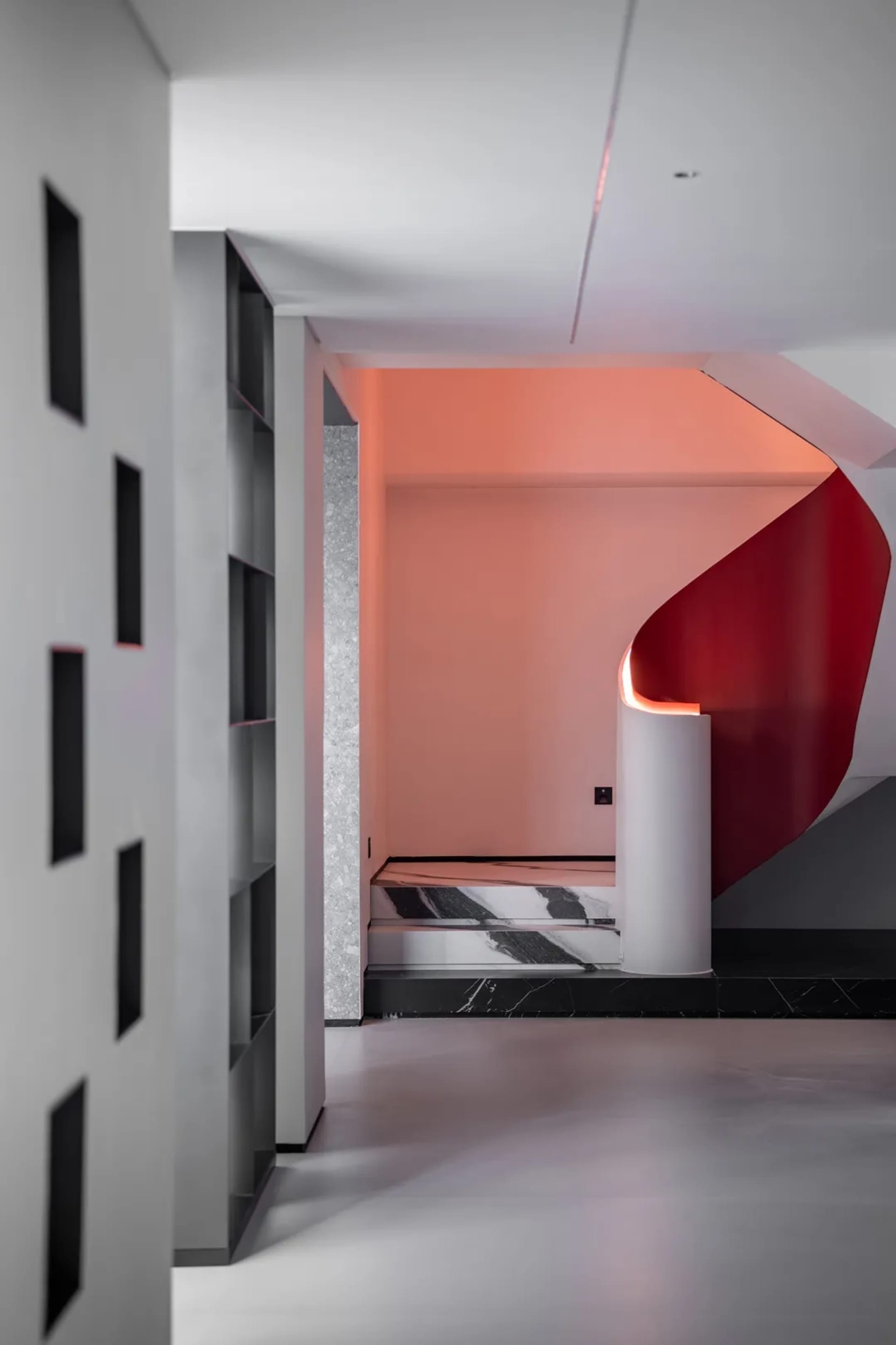 An interior design featuring modern living space with concrete and marble elements.