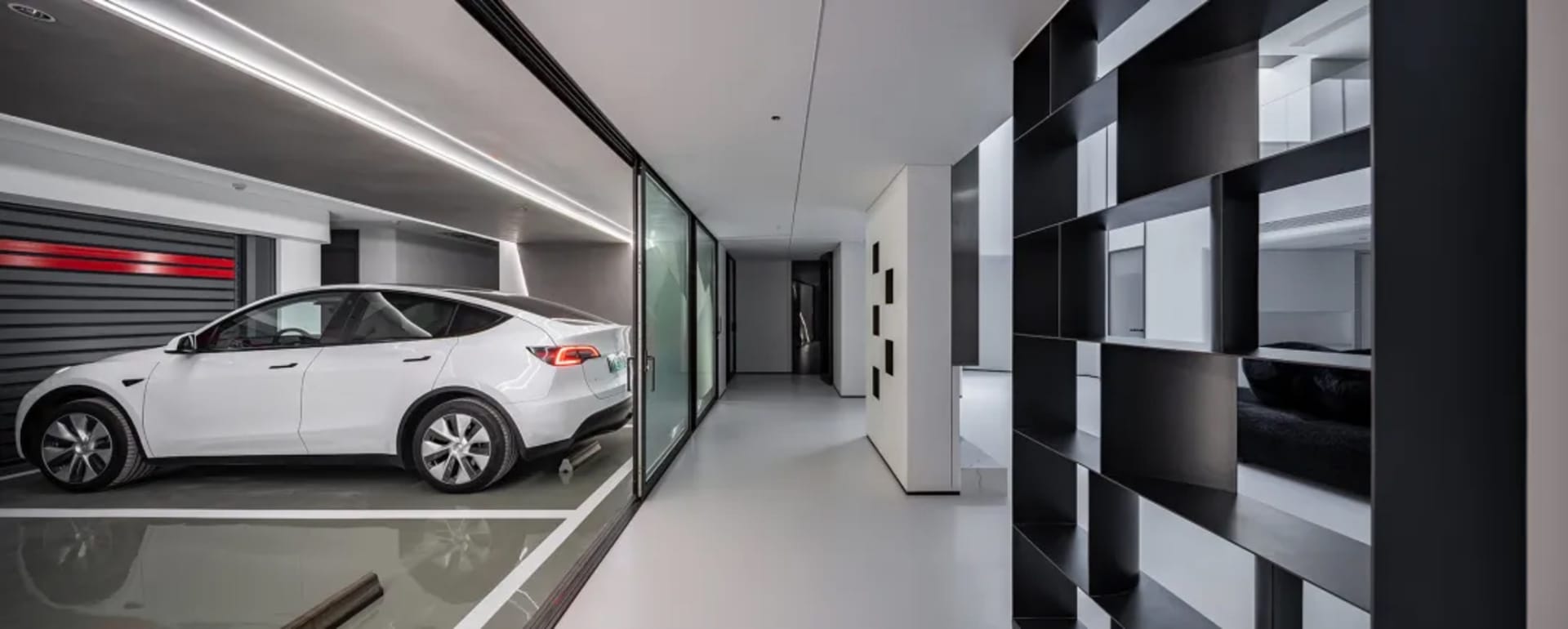 Modern interior design featuring glass and concrete architectural elements.