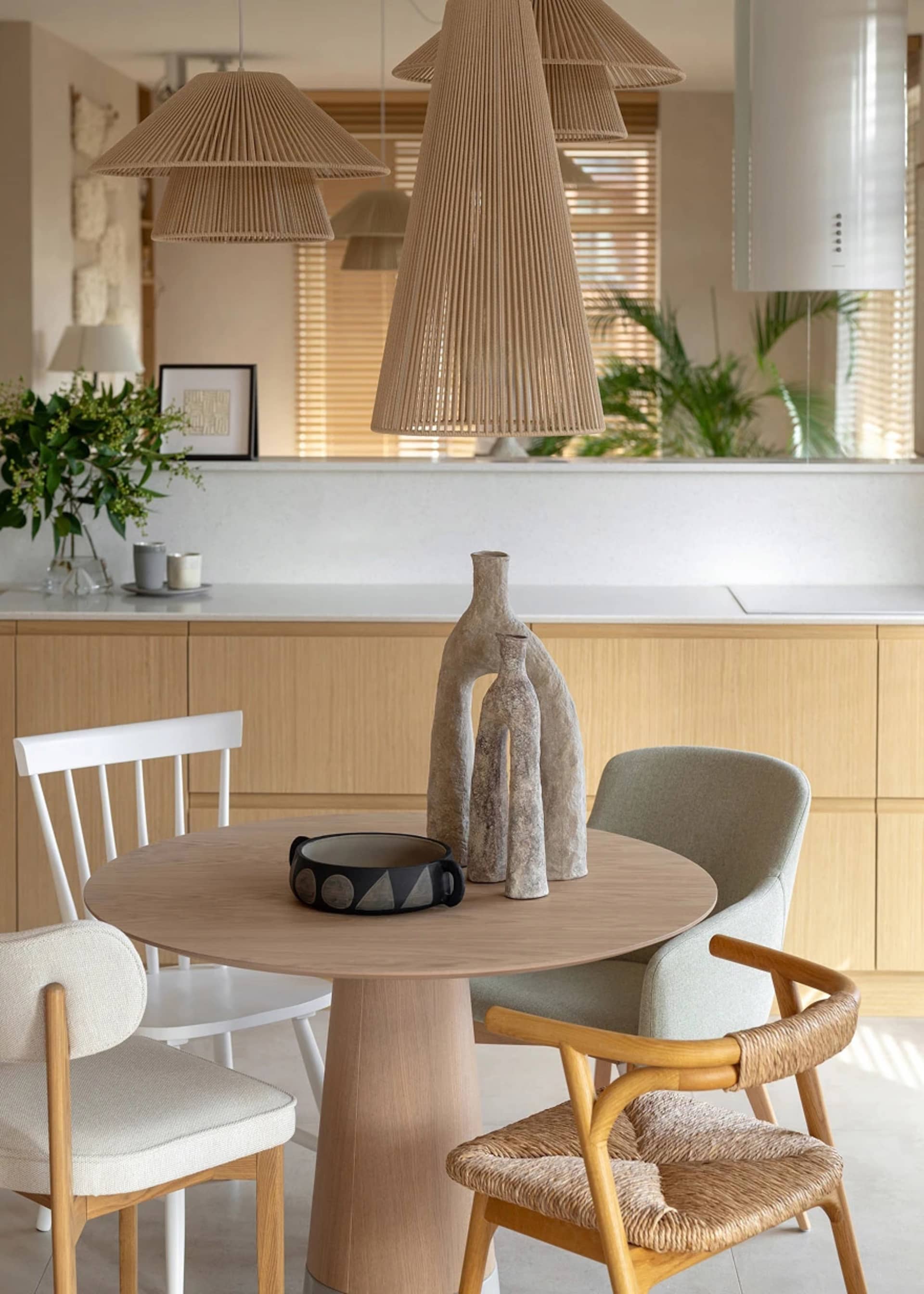 Modern dining room with wooden furniture and minimalist decor.