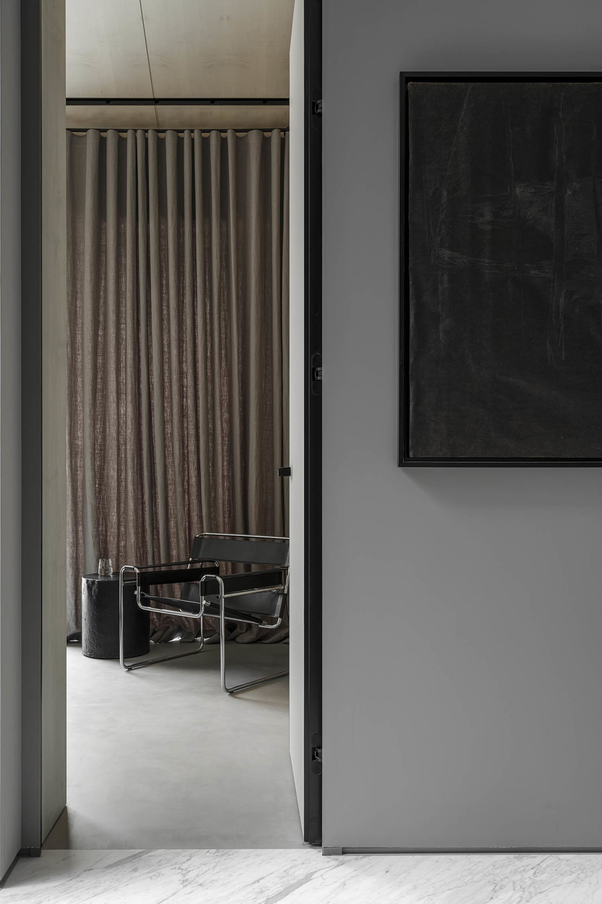 Modern interior design with black furniture and lighting