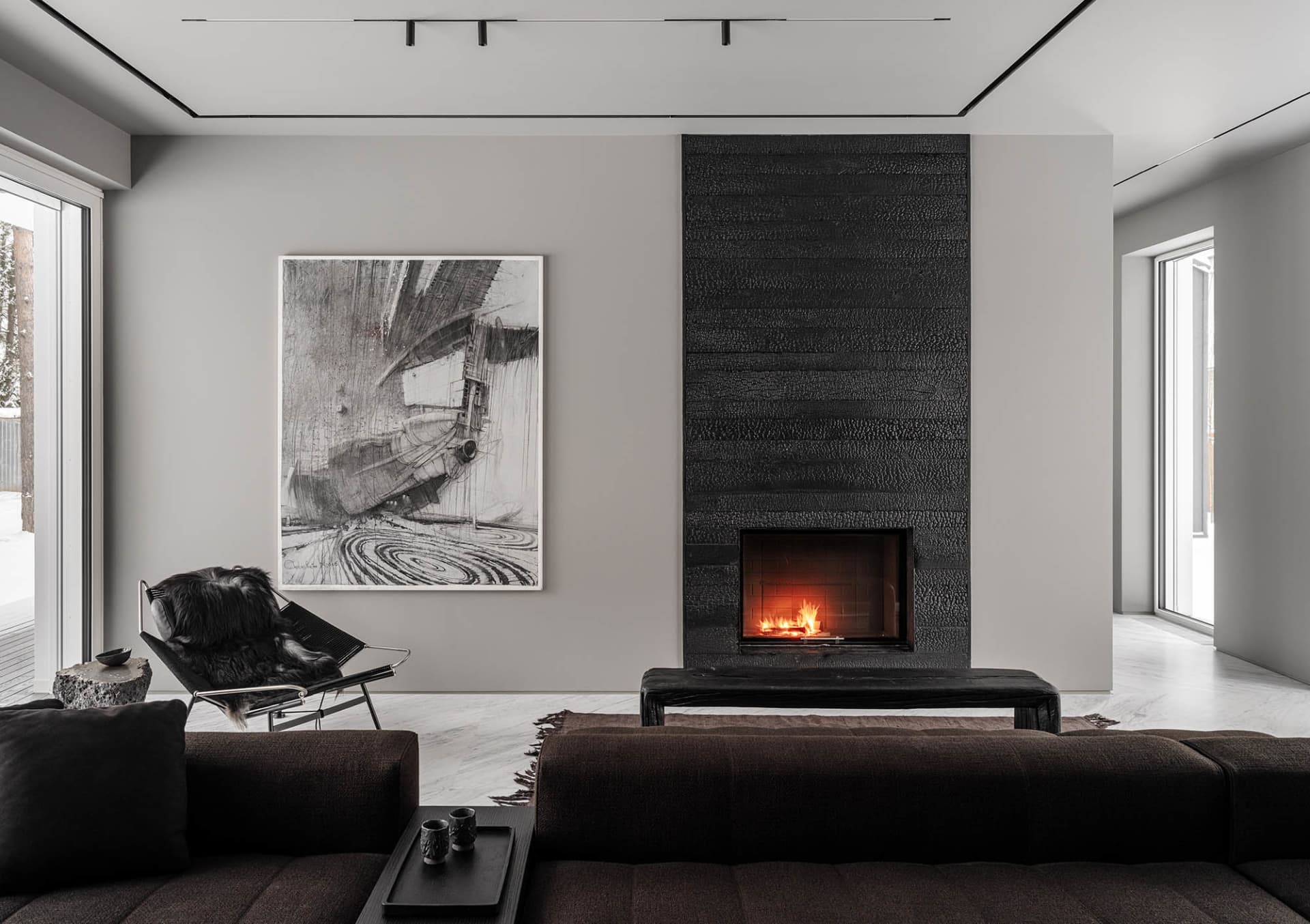 Modern living room with a concrete fireplace and minimalist design