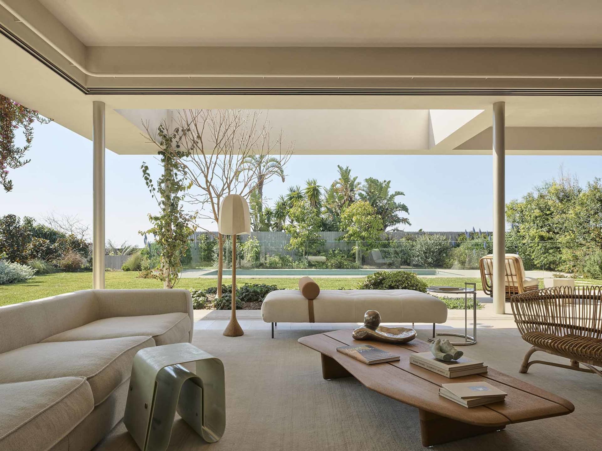 Modern living room featuring concrete, glass, and wood materials.
