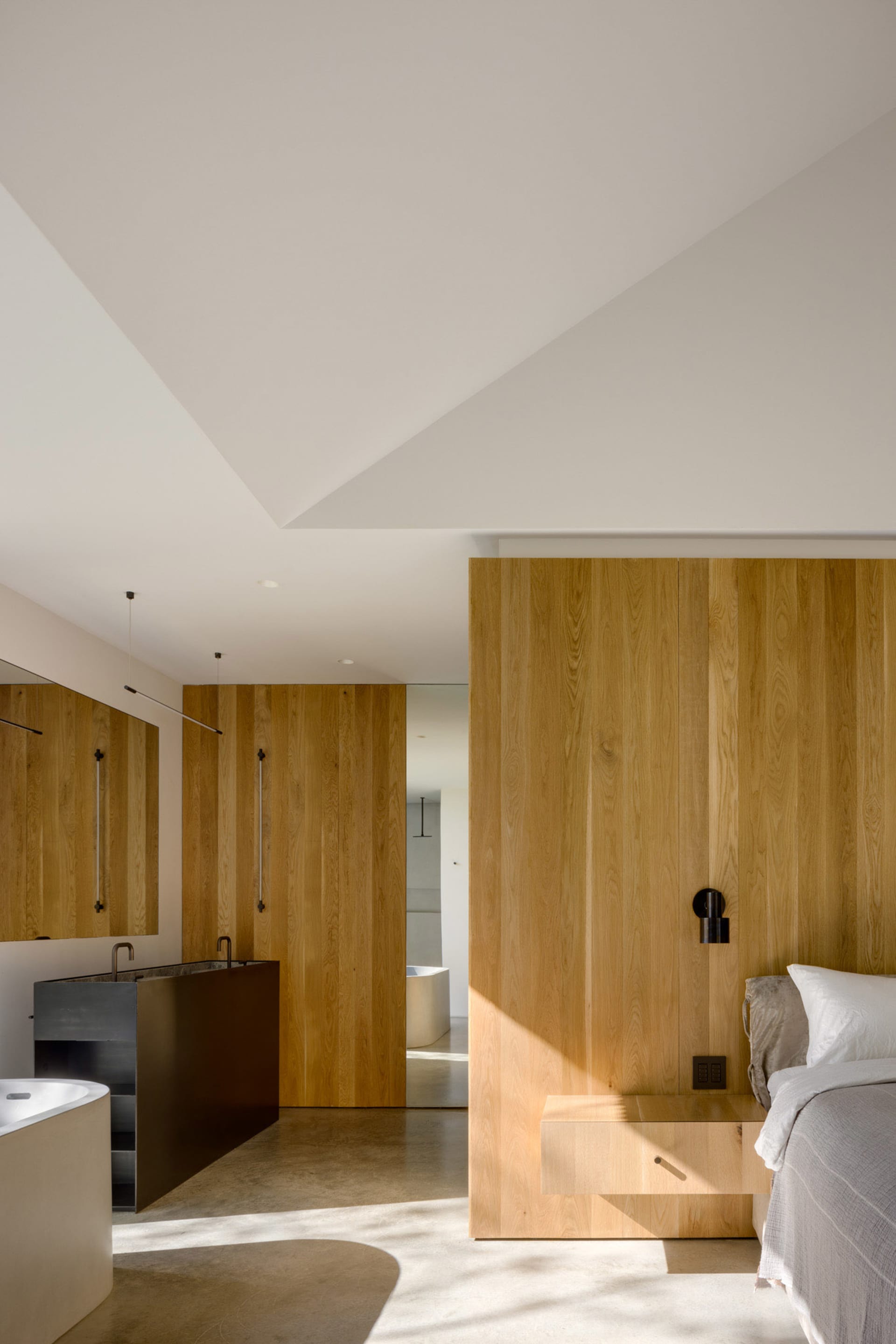 Modern bedroom featuring wood paneling and minimalist design