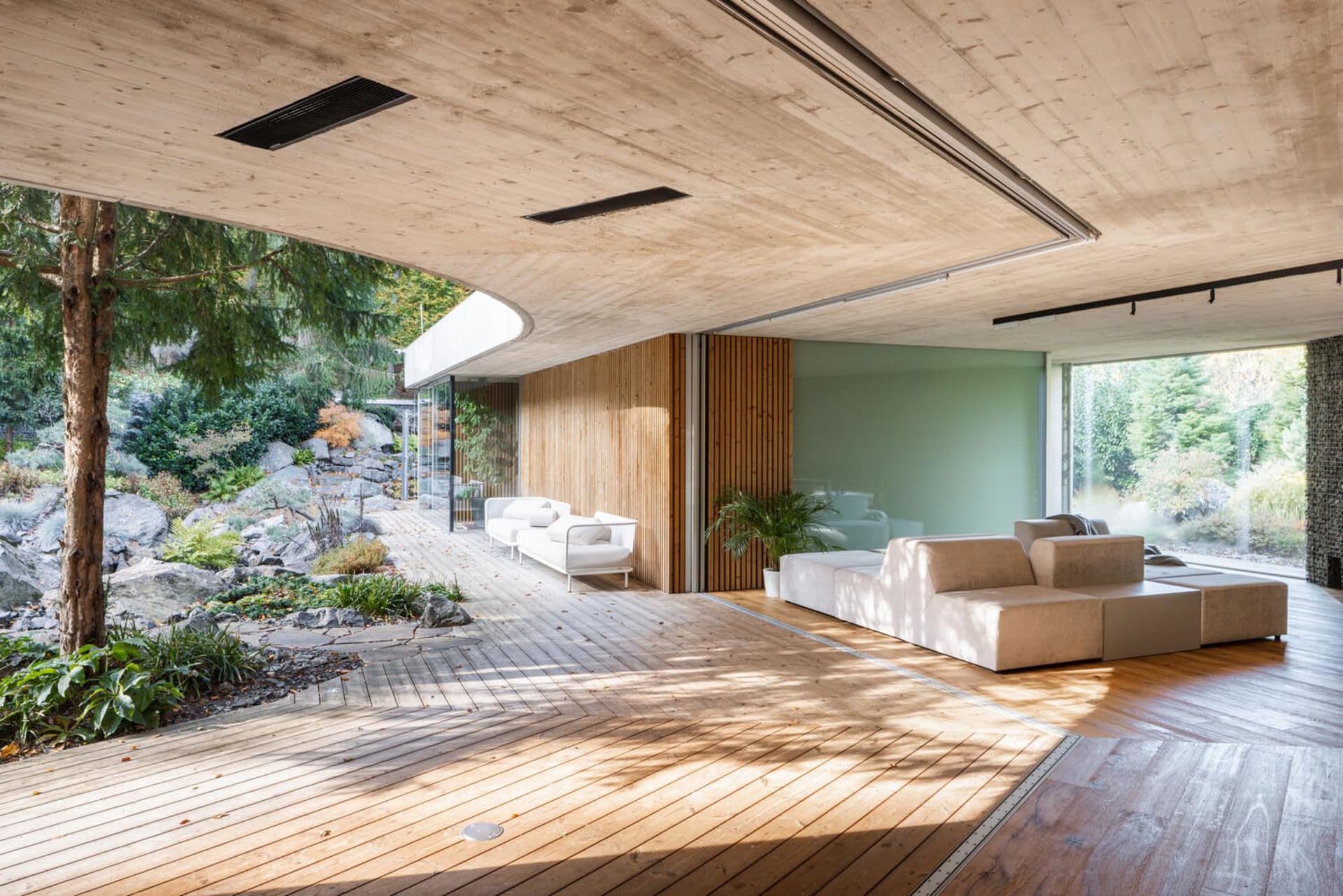 Modern minimalist living room with wood elements and natural light