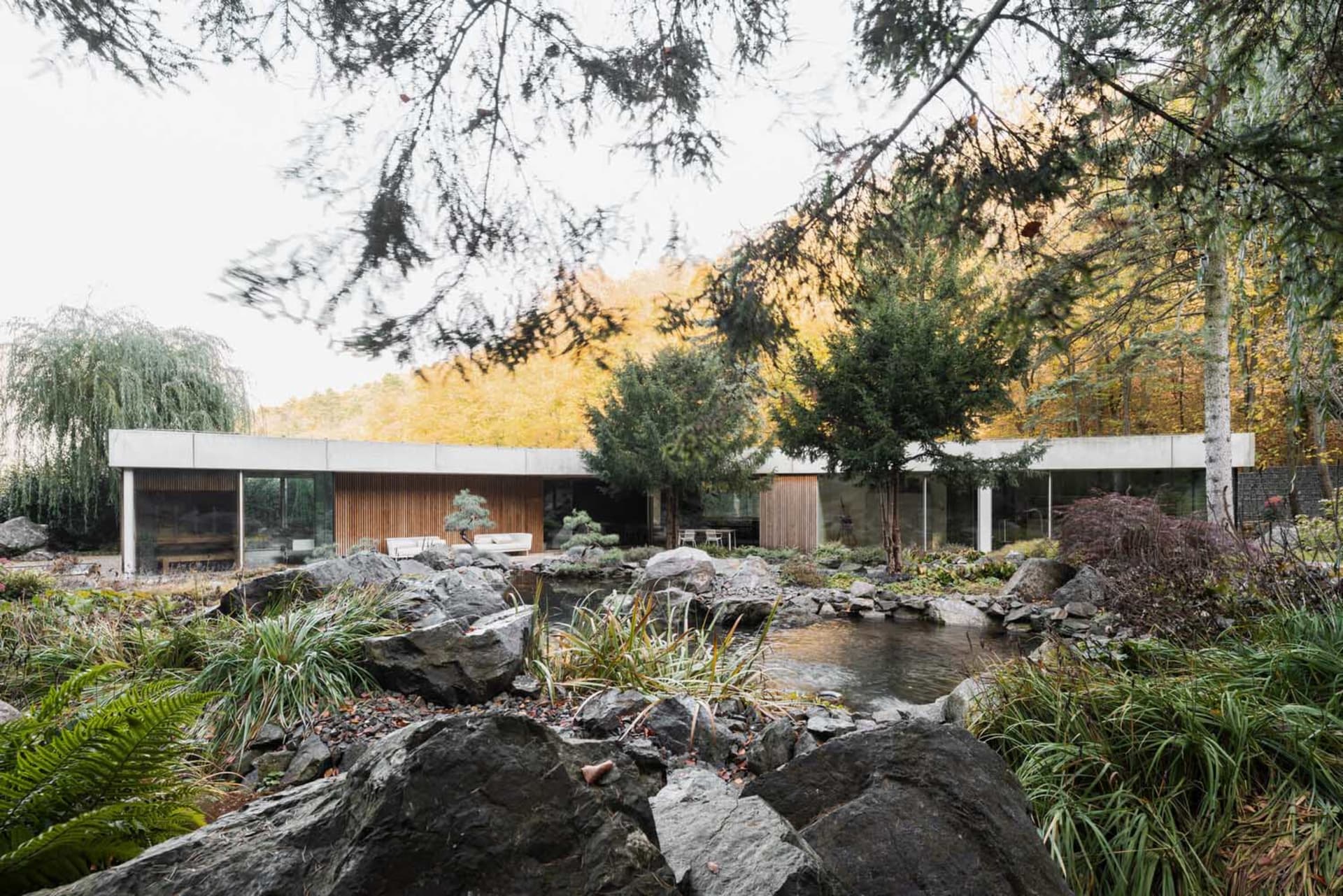Modern residential building constructed with concrete materials, featuring a minimalist design.