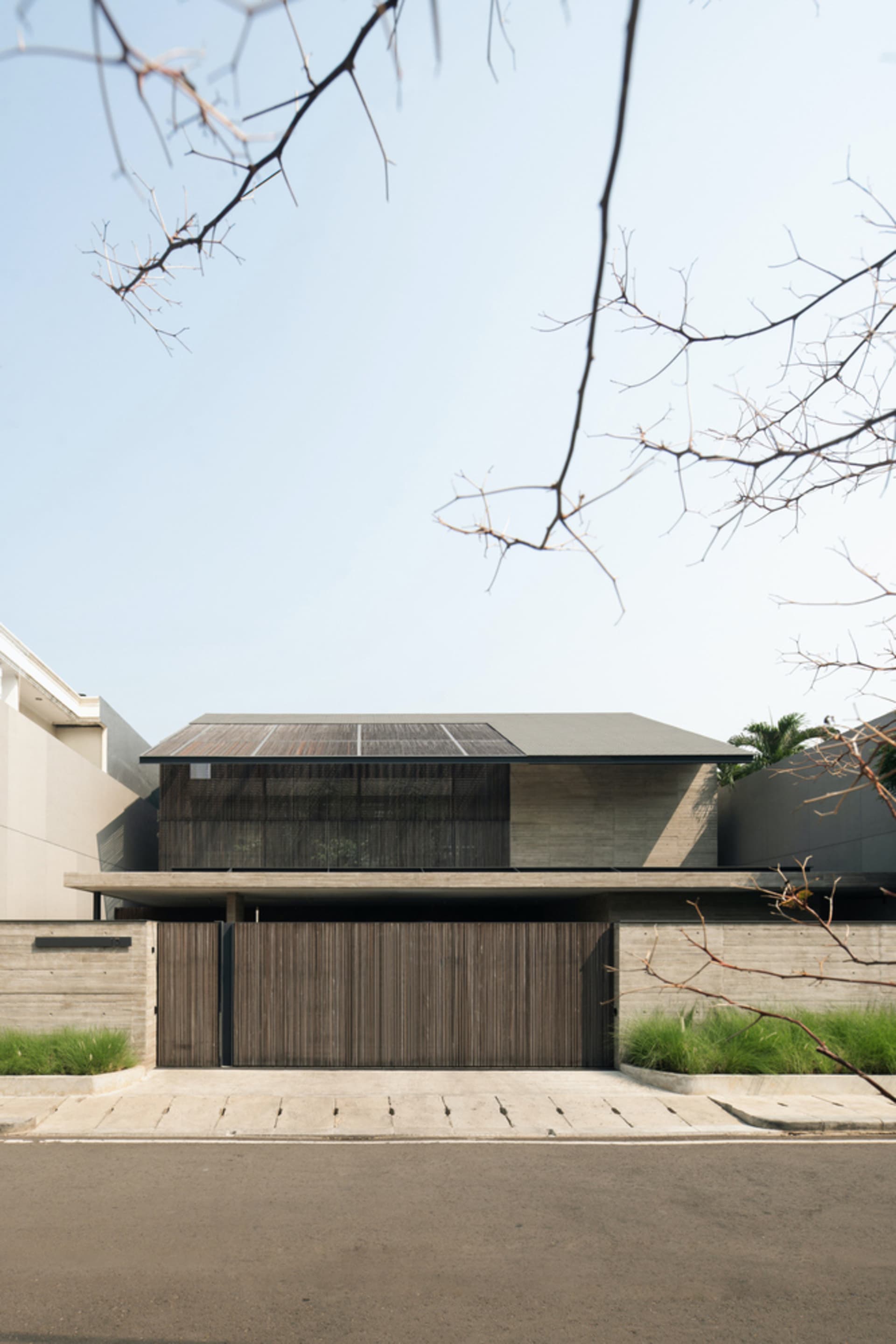 A modern residential building with a concrete exterior.
