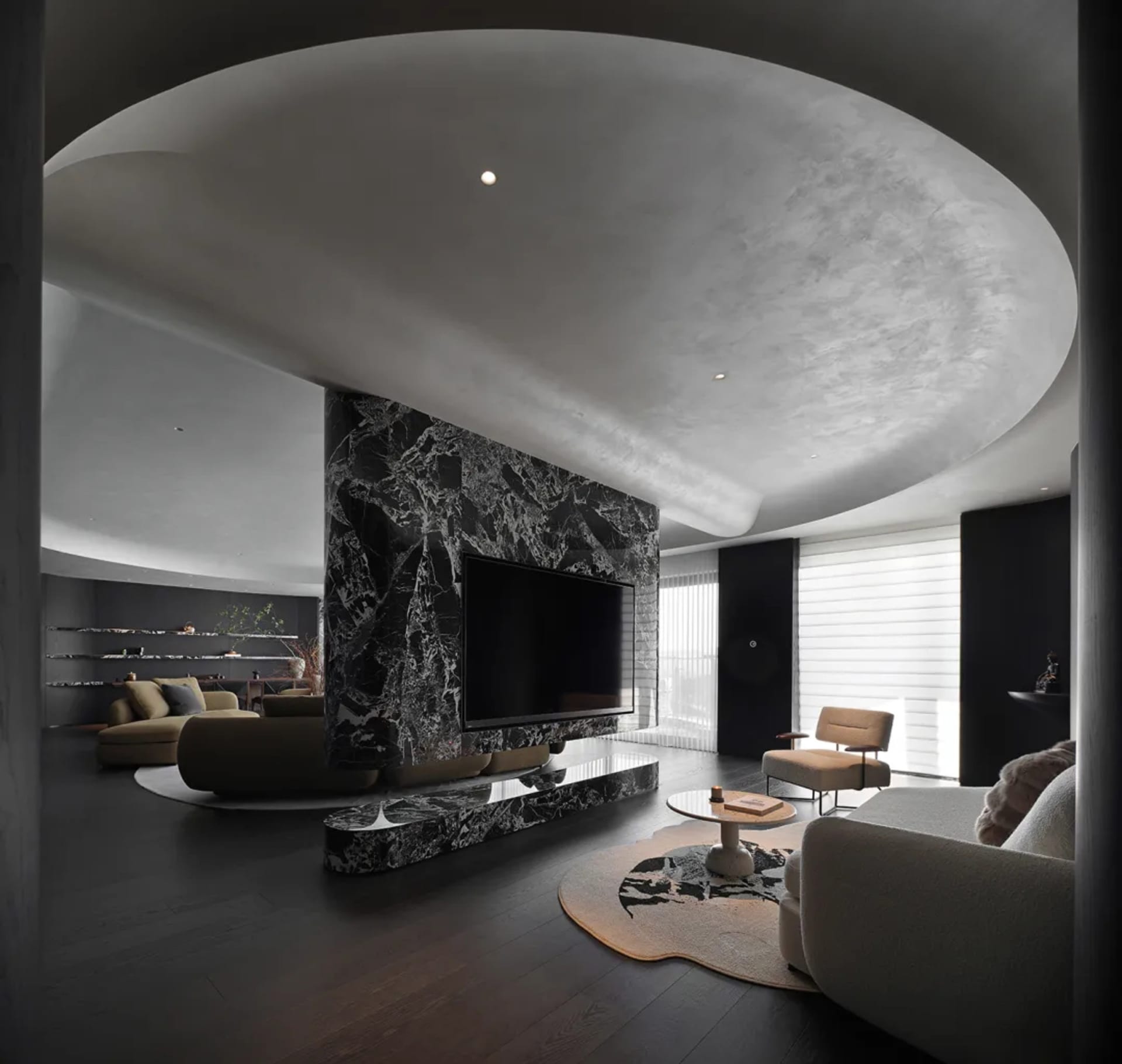 A modern living room featuring marble accents and a contemporary aesthetic.