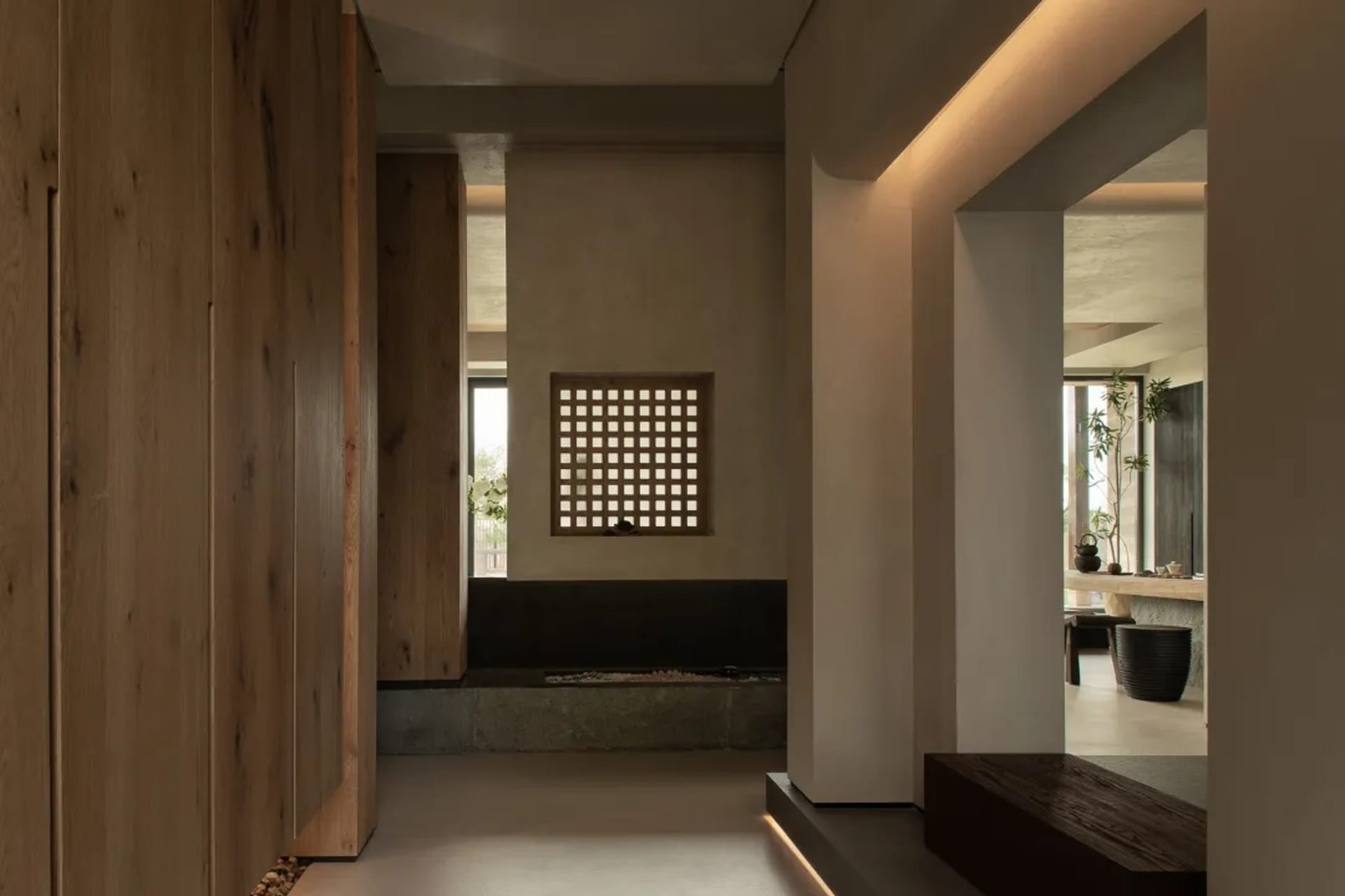 Modern living room featuring wooden walls, concrete floor, and glass windows