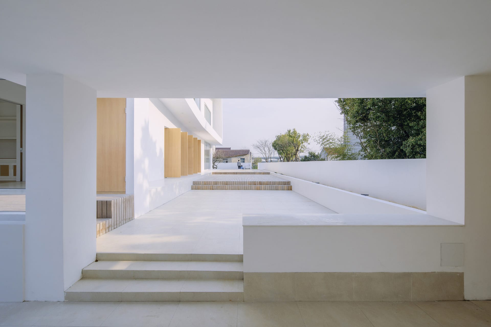 Modern architecture with white concrete walls and a minimalist design.