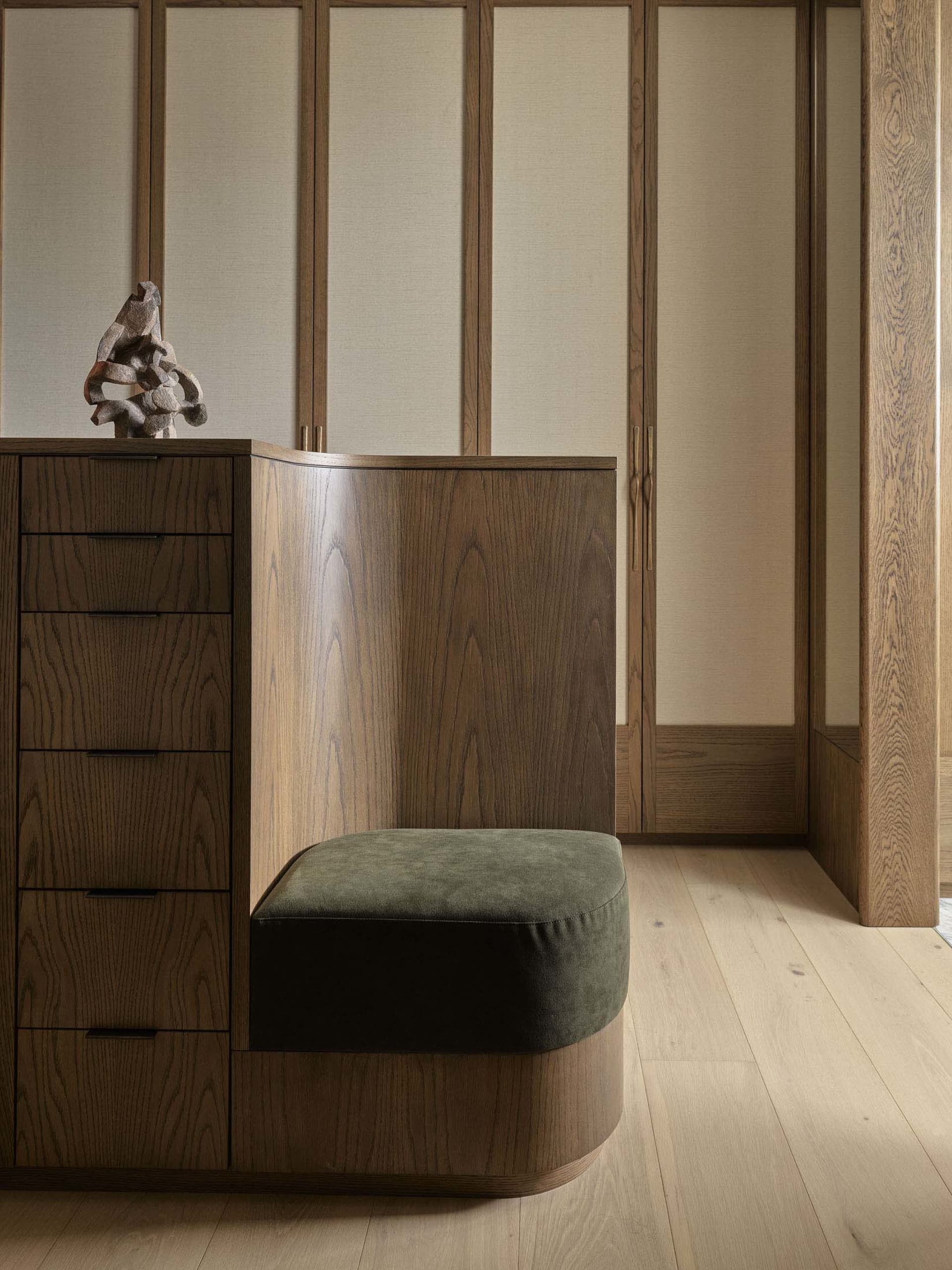 A minimalist interior space featuring wenge wood furniture