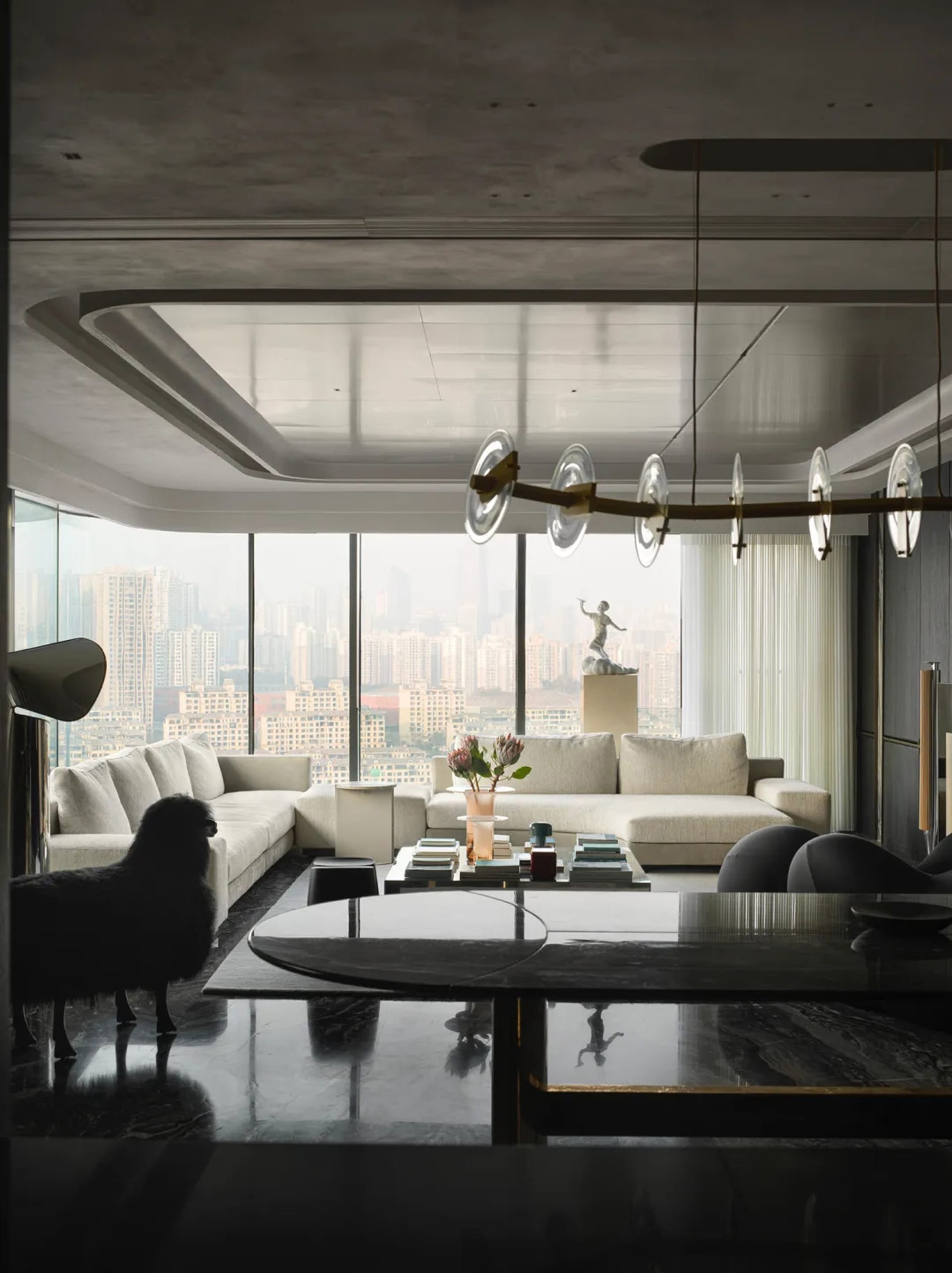 Modern living room featuring concrete and glass walls, marble flooring, and minimalist furniture.
