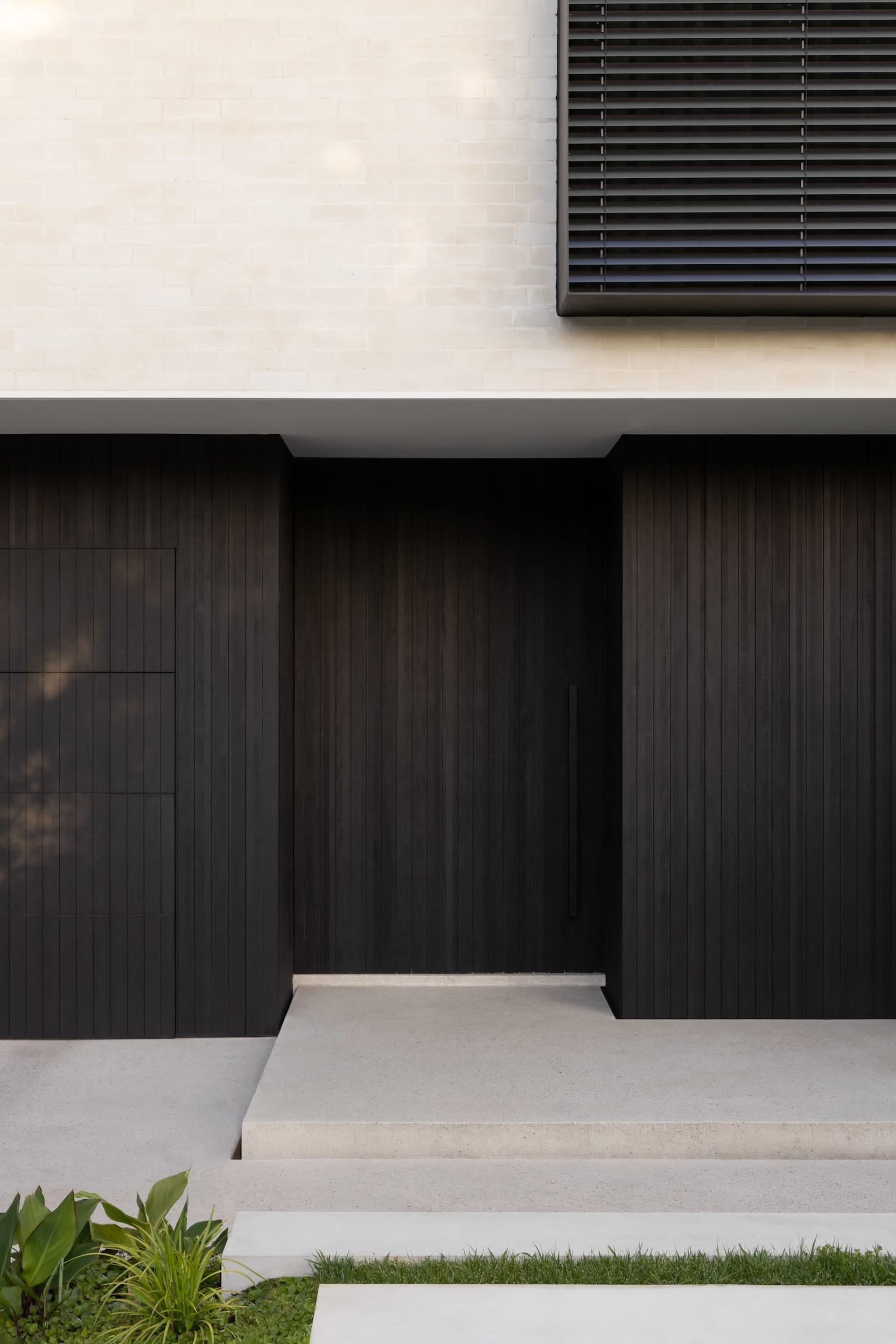 Concrete and wood modern entrance door