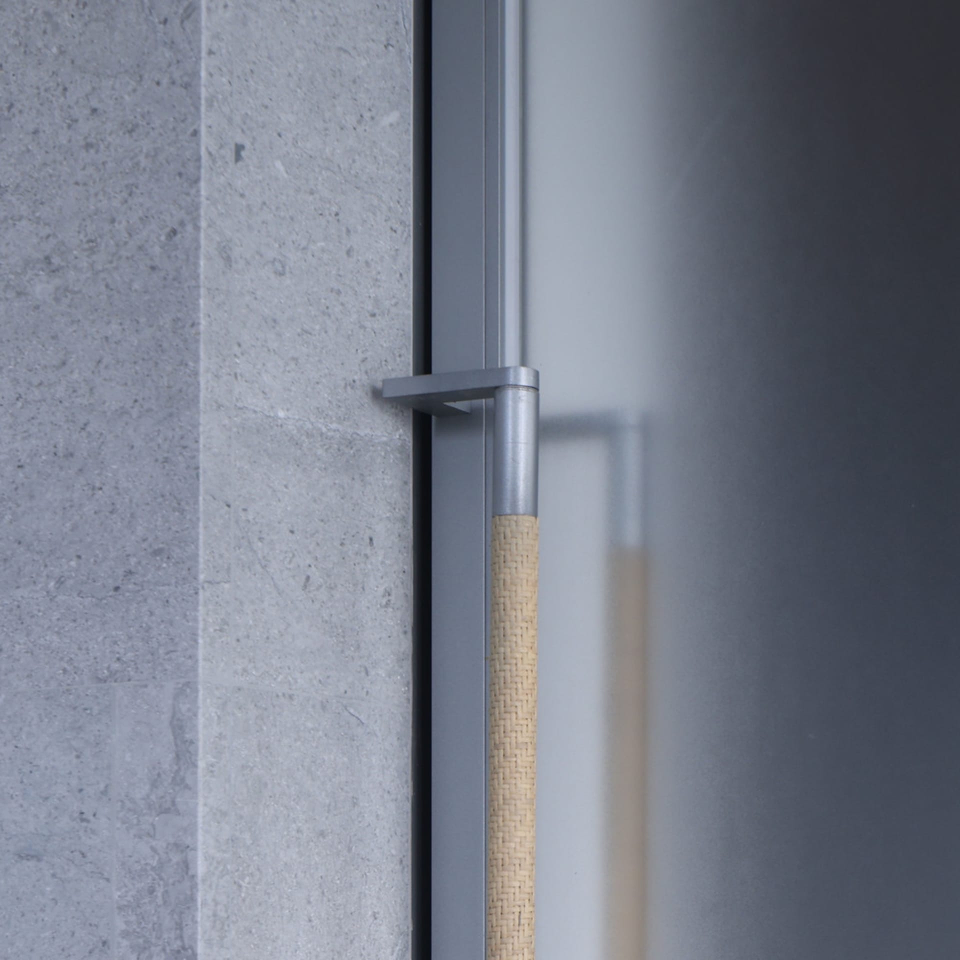 A close-up image of a modern design featuring concrete material, showcasing the texture and finish of contemporary architectu