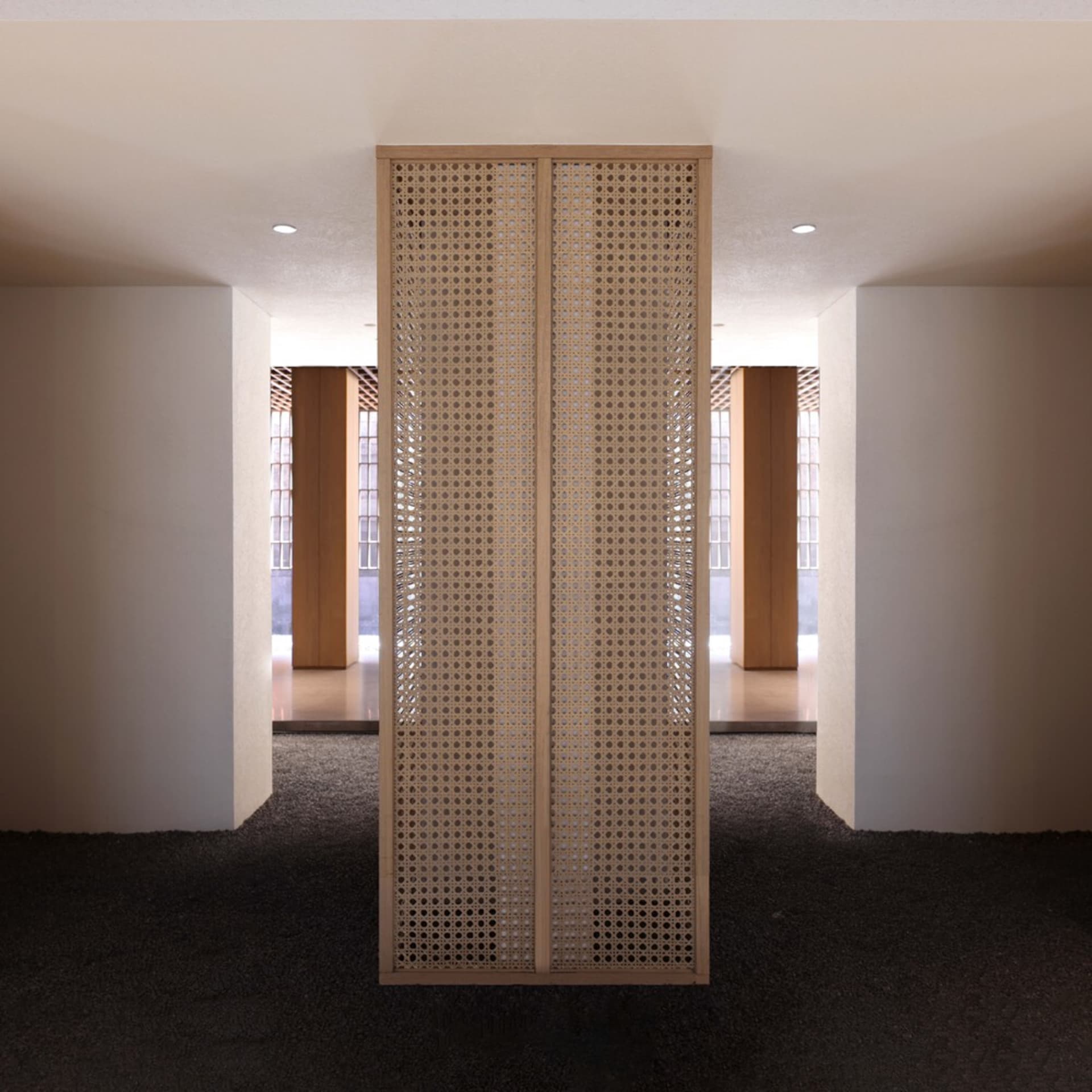 Modern interior design featuring a woven panel wall with a minimalist aesthetic