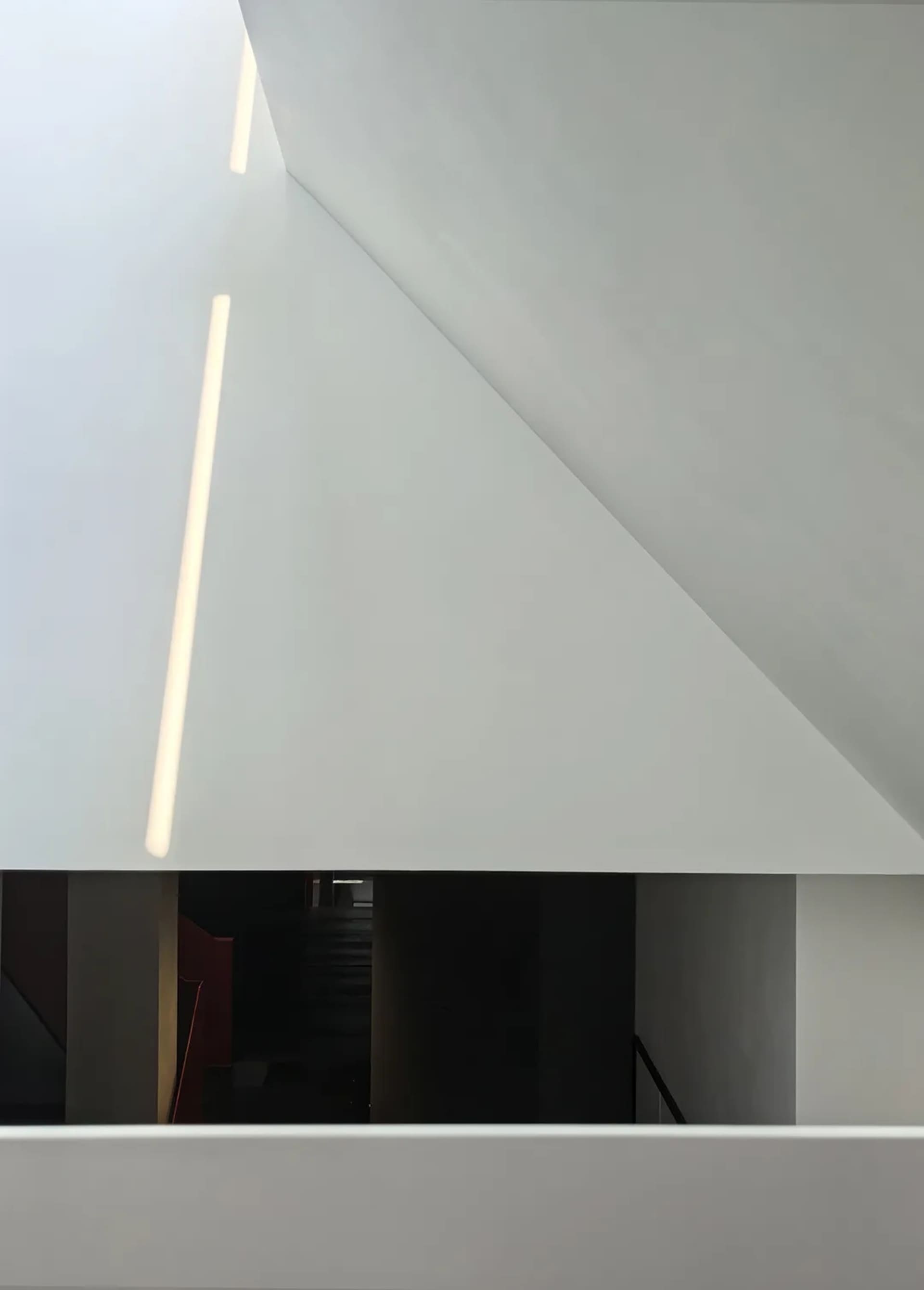 Minimalist modern interior architecture space with concrete and glass materials.