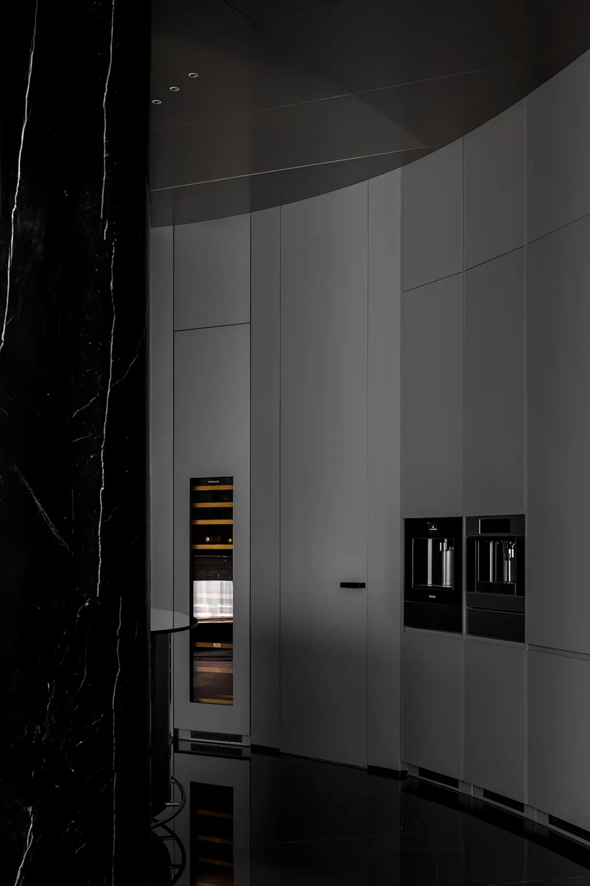 Modern kitchen with marble countertops and cabinets