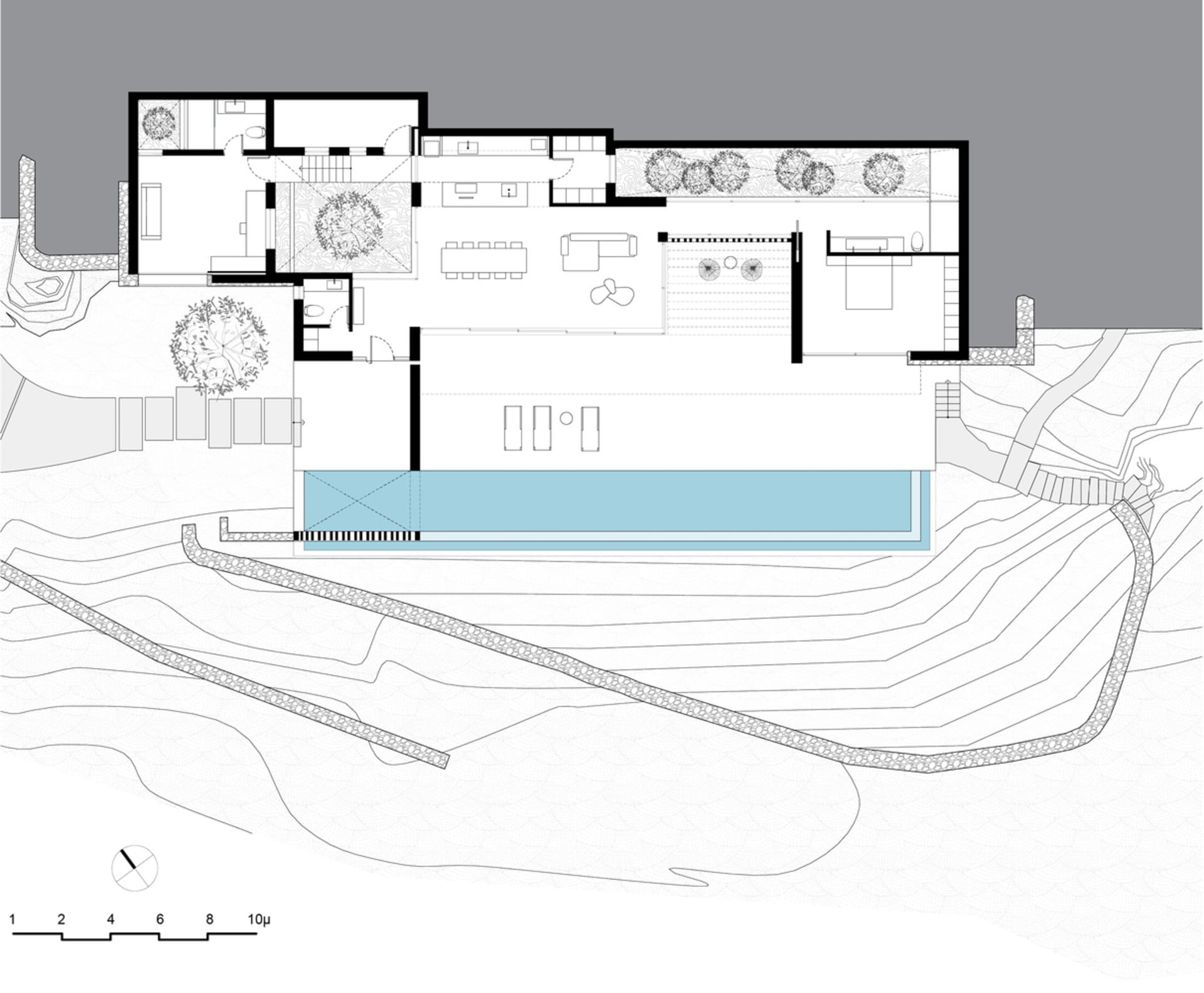 A floor plan of a modern house with glass elements.