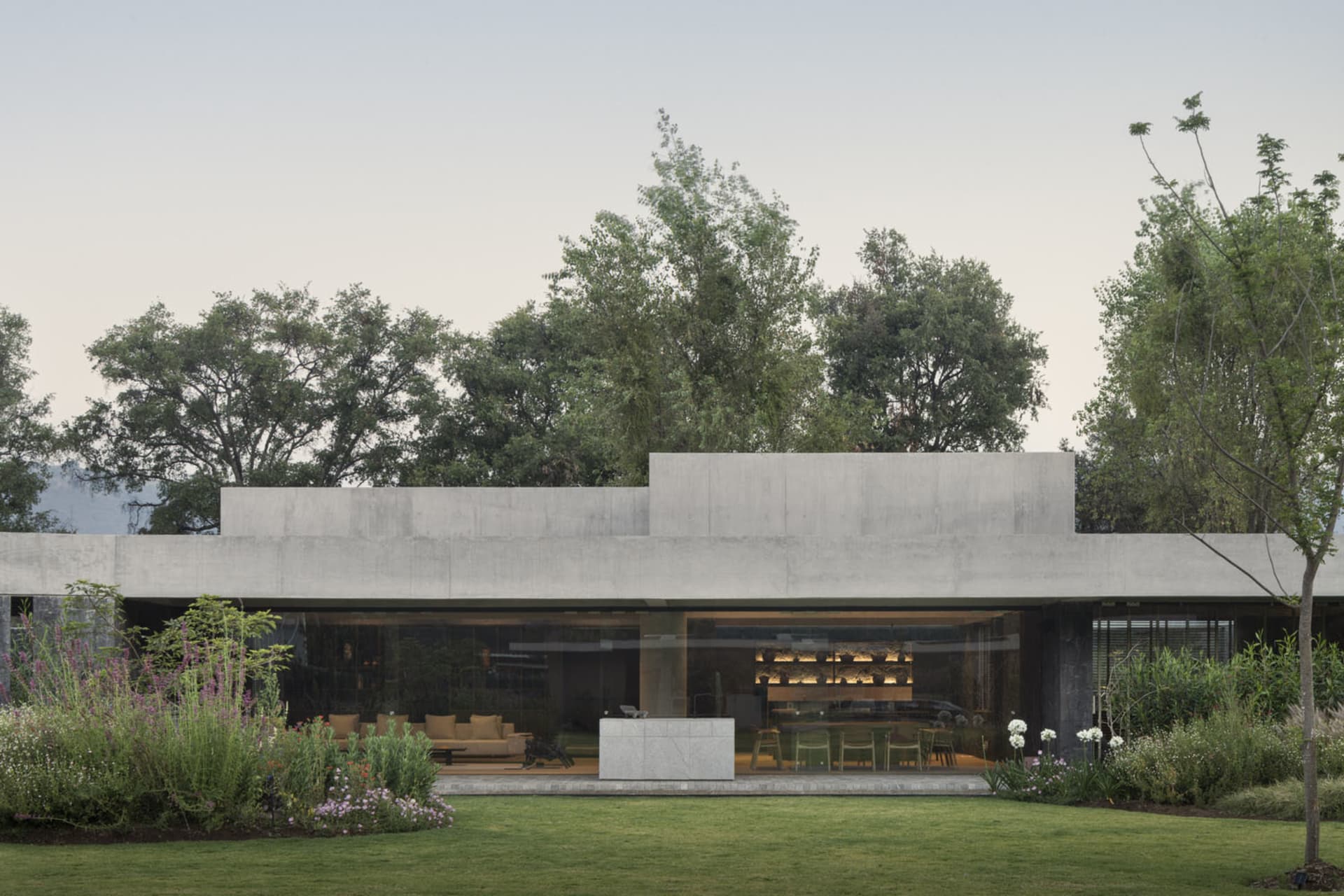 Modern house featuring a sleek, concrete exterior in a contemporary design setting