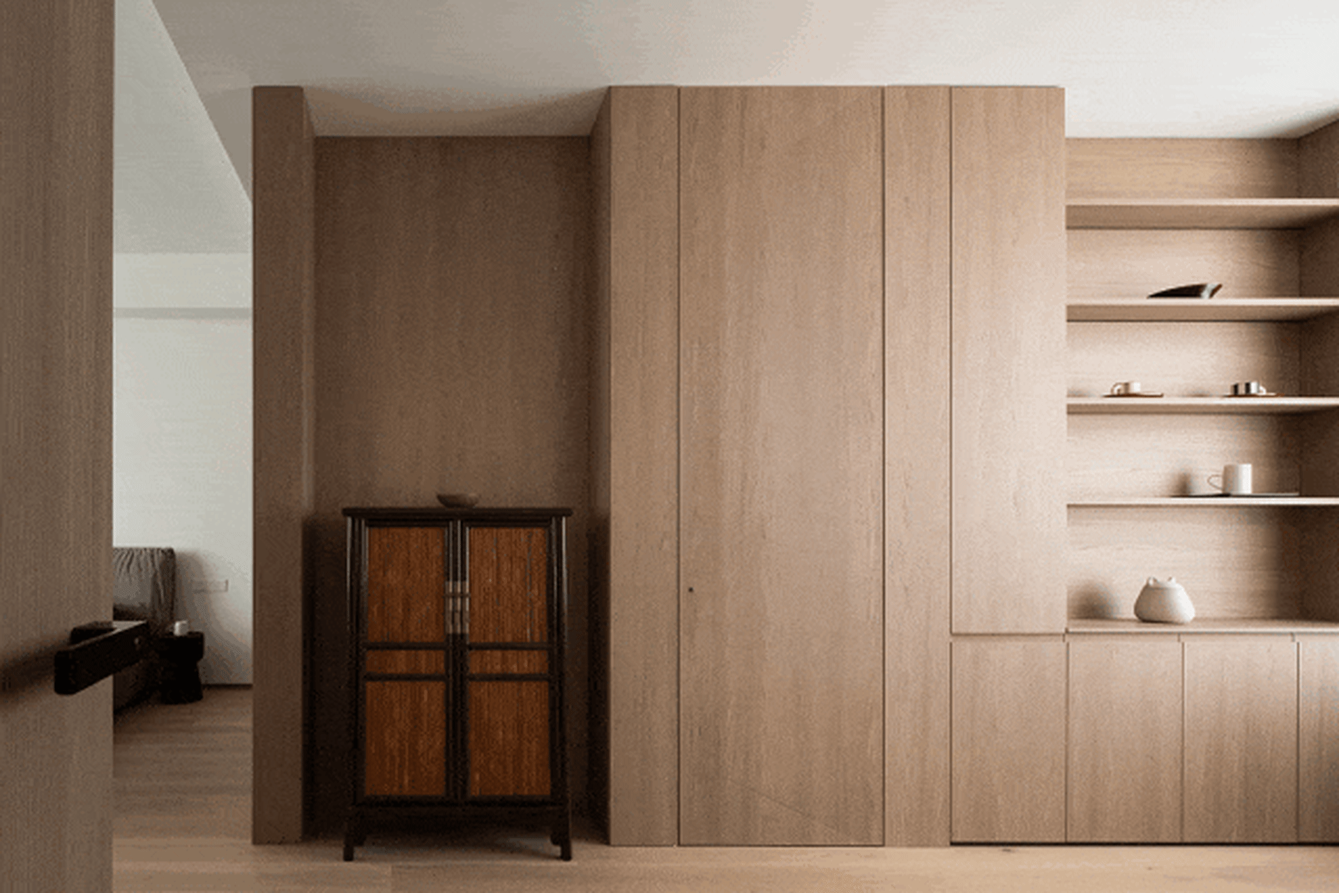 A modern minimalist living room featuring wooden panels.