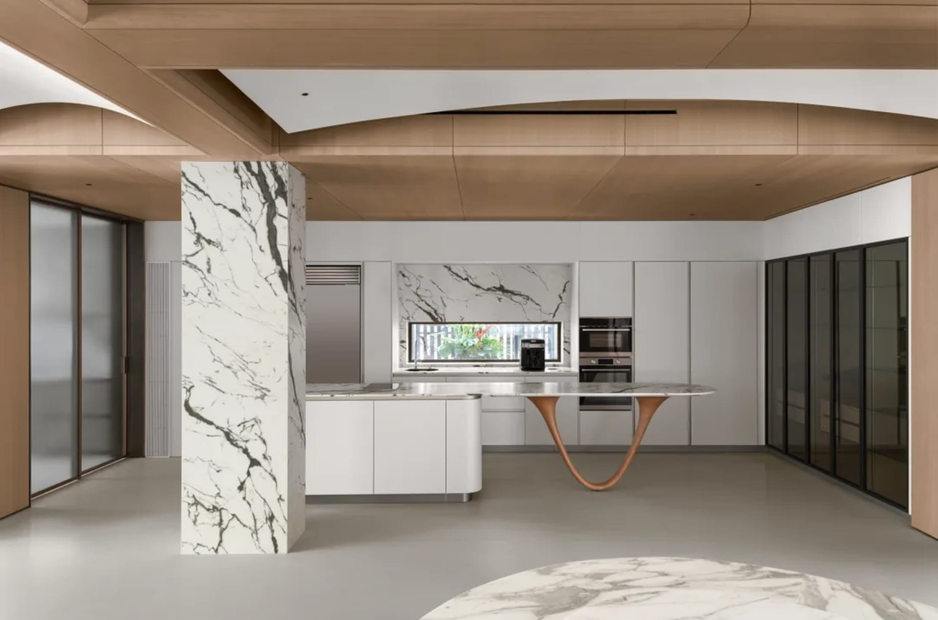 Modern residential kitchen featuring a marble countertop and floor.