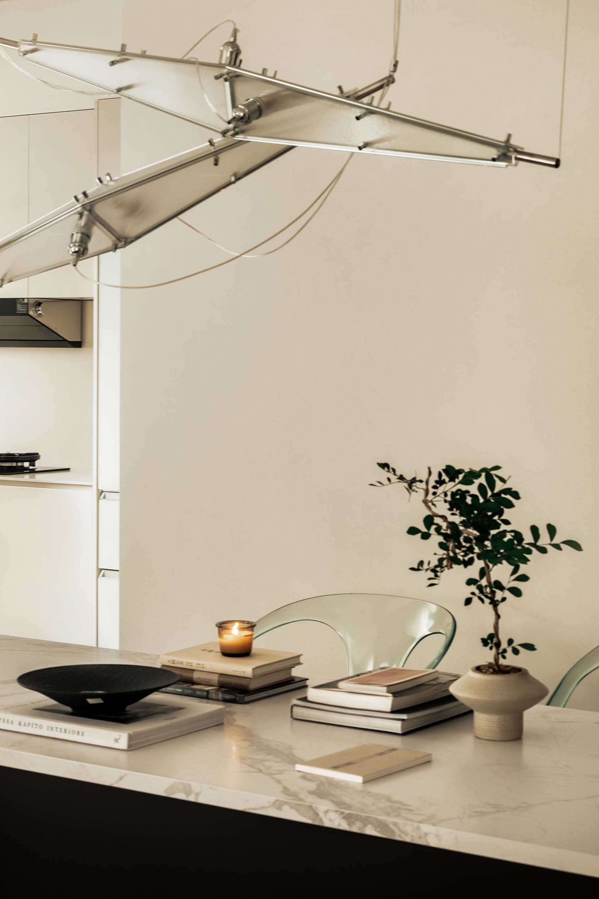 A modern kitchen with a marble floor plan