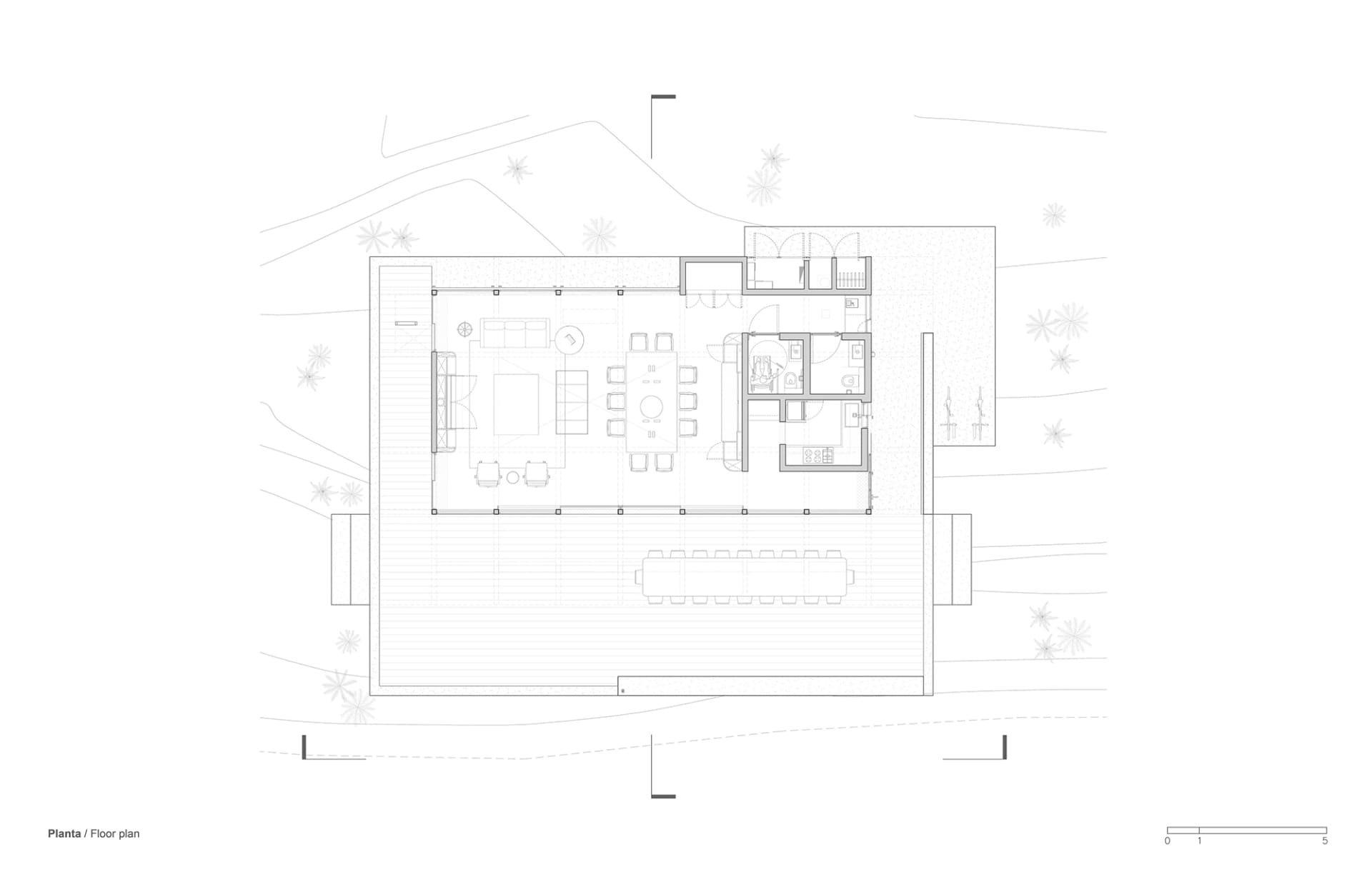 Floor plan of a modern residential building with indoor and outdoor spaces.