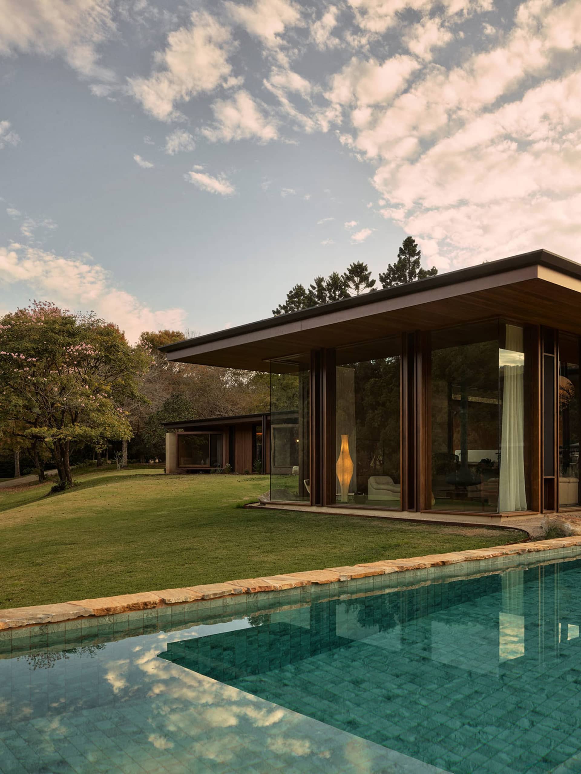A modern house with large glass windows.