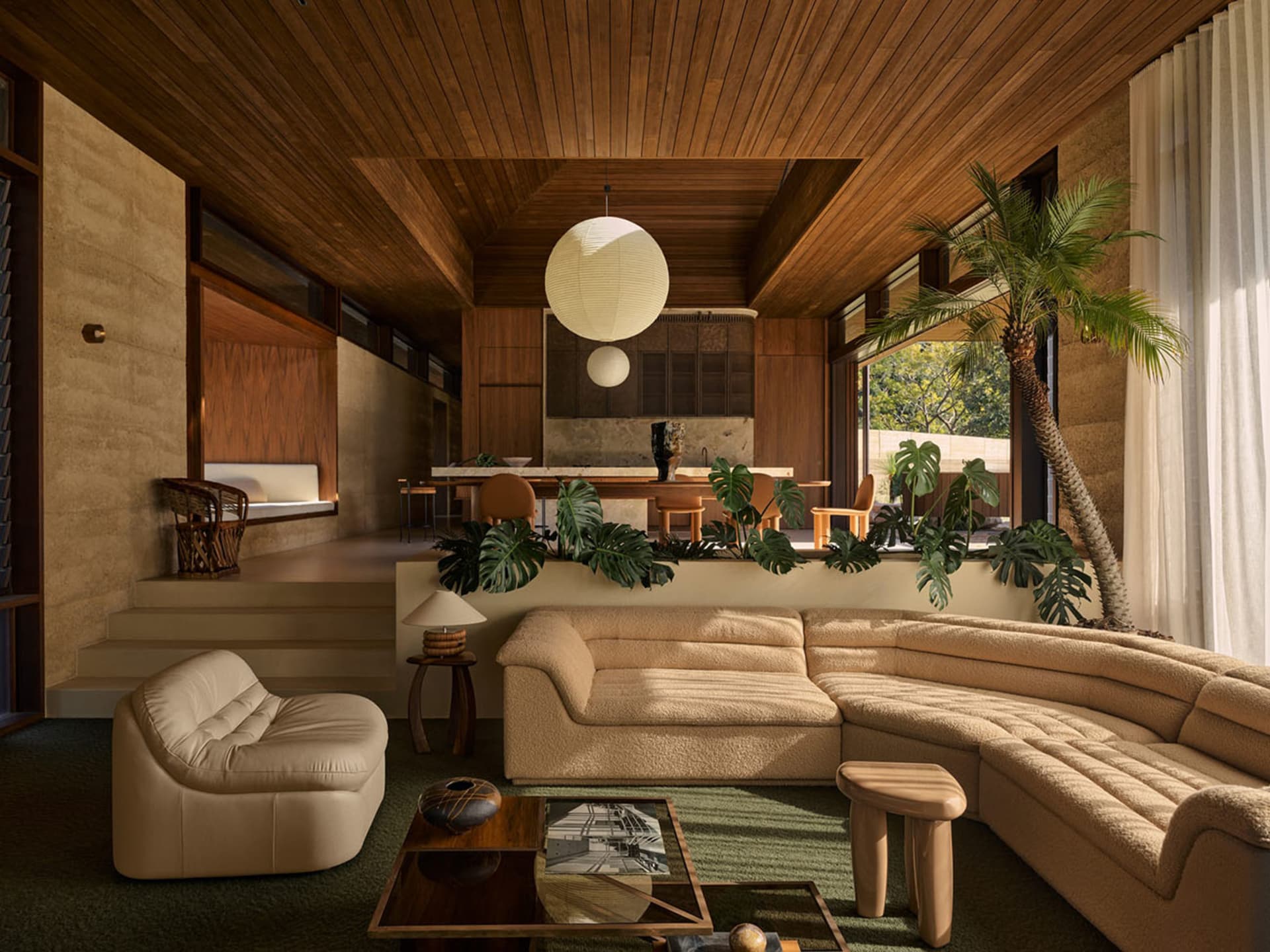 Modern living room with wooden walls, curved sofa, and indoor plants.