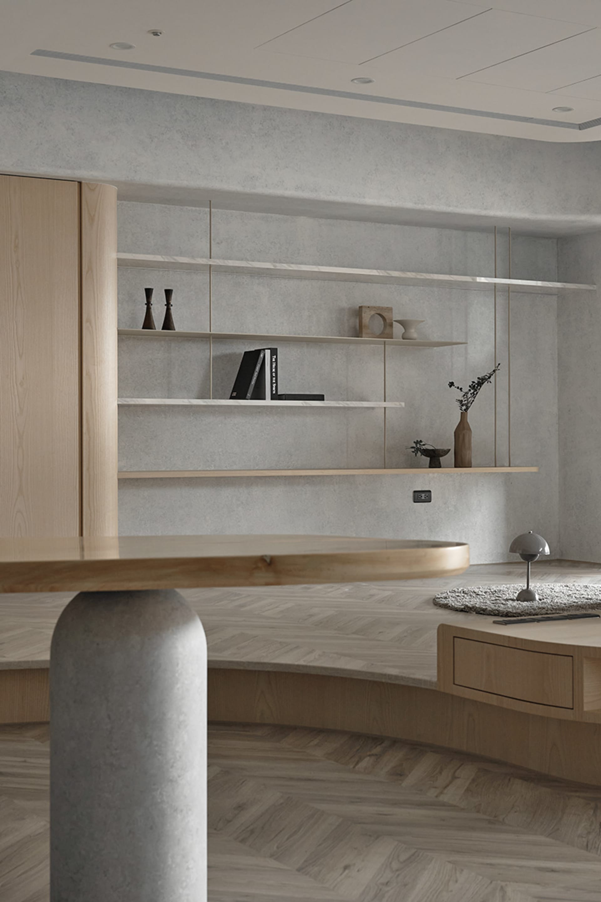 A modern minimalist living room featuring a wooden coffee table and floating shelves.
