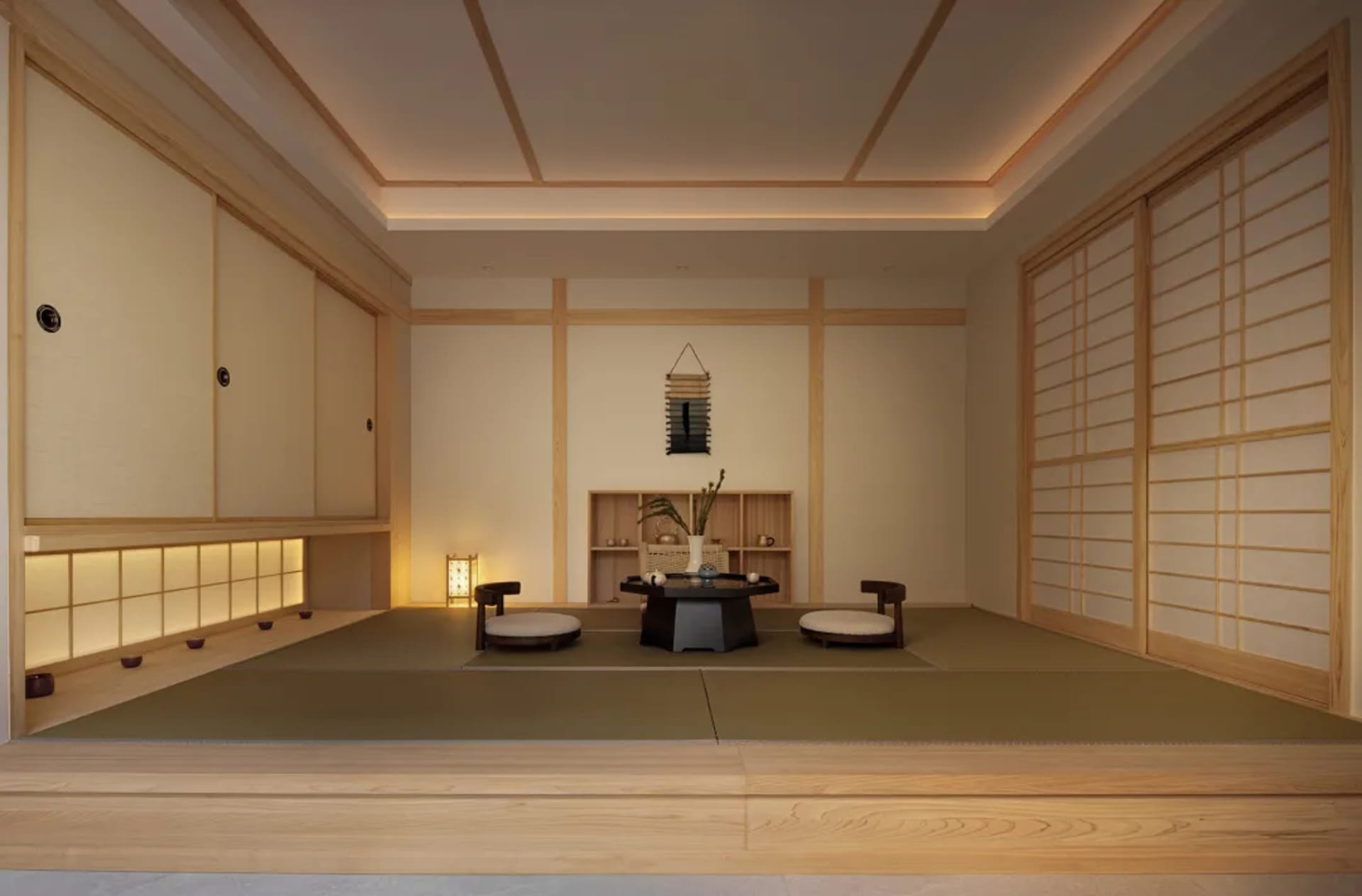A modern minimalist living room with tatami mats, wood furniture, and white walls.