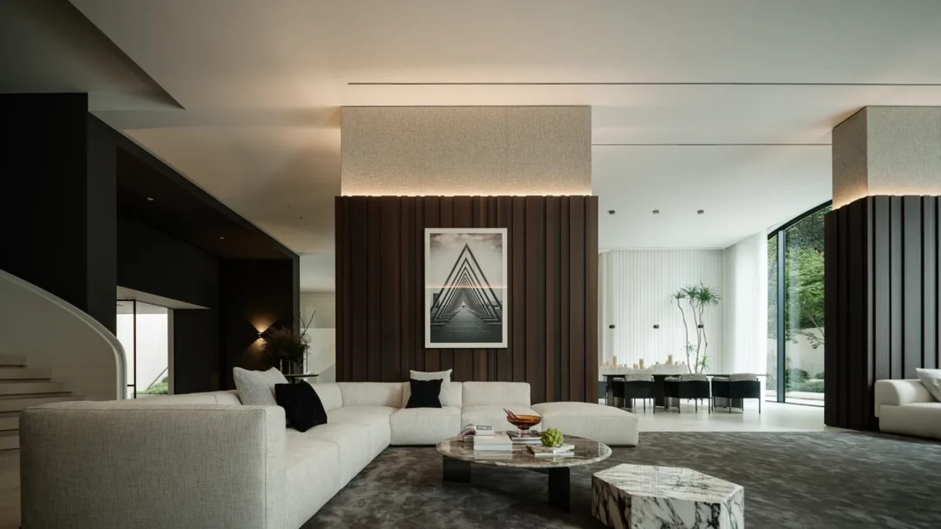 Minimalist living room featuring marble flooring and minimalist furniture.