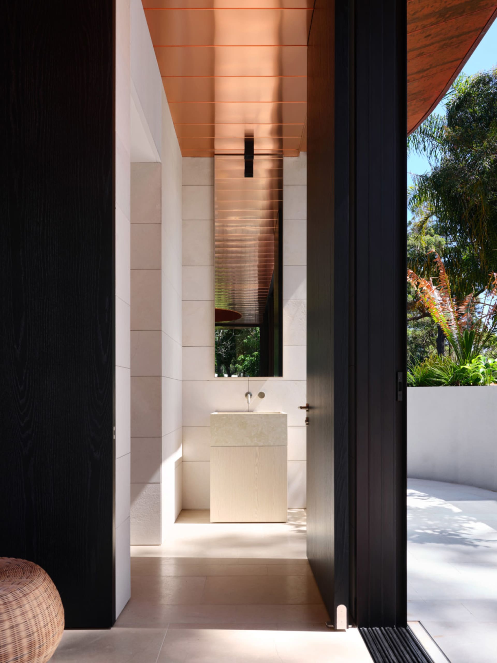 A modern bathroom with a concrete floor and walls.