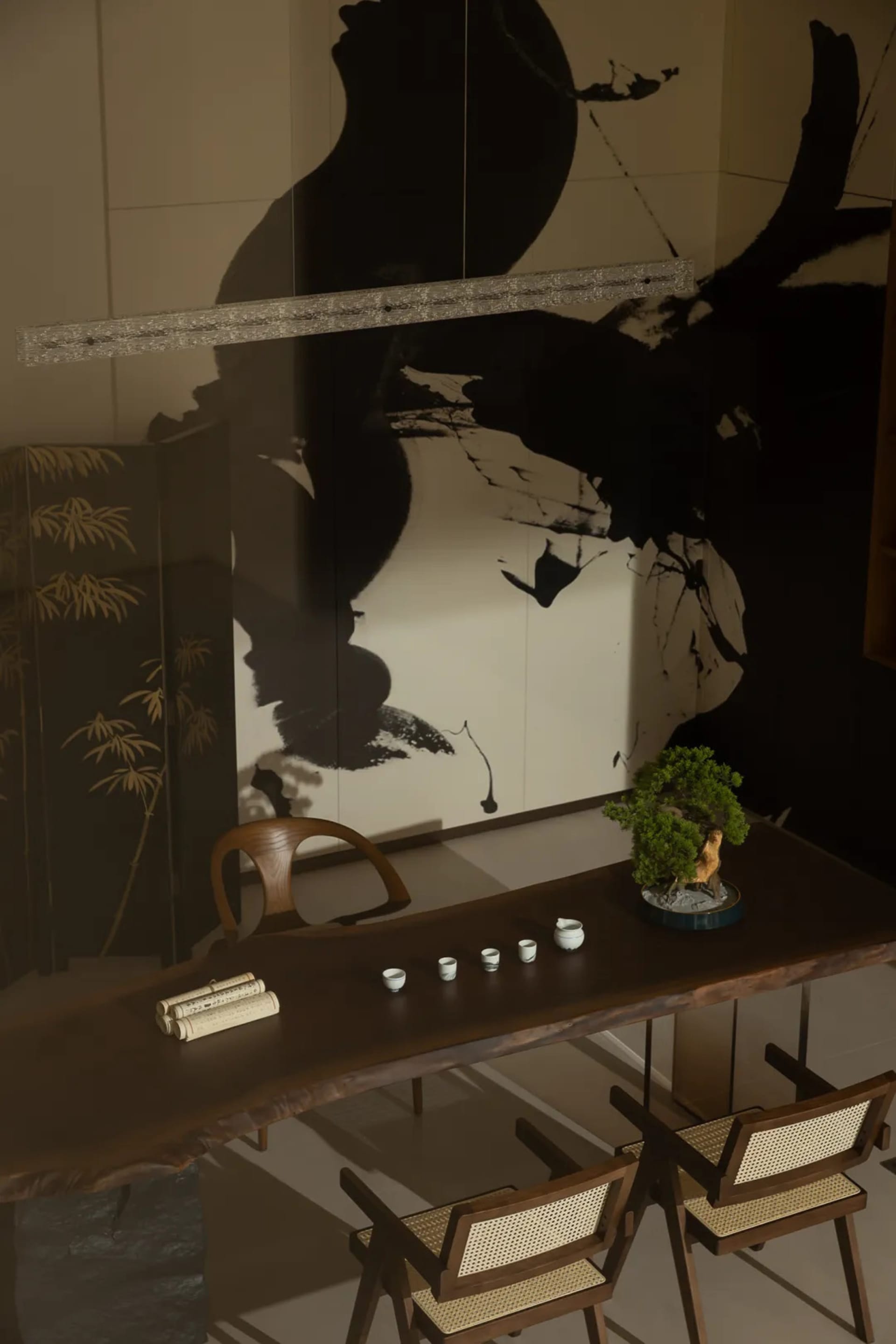 A minimalist interior design showcasing wood flooring and concrete furniture details.