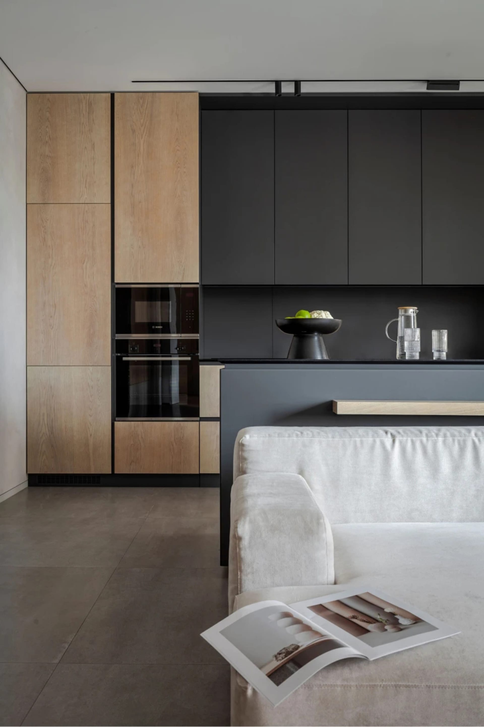Contemporary kitchen with wooden cabinetry and metallic appliances