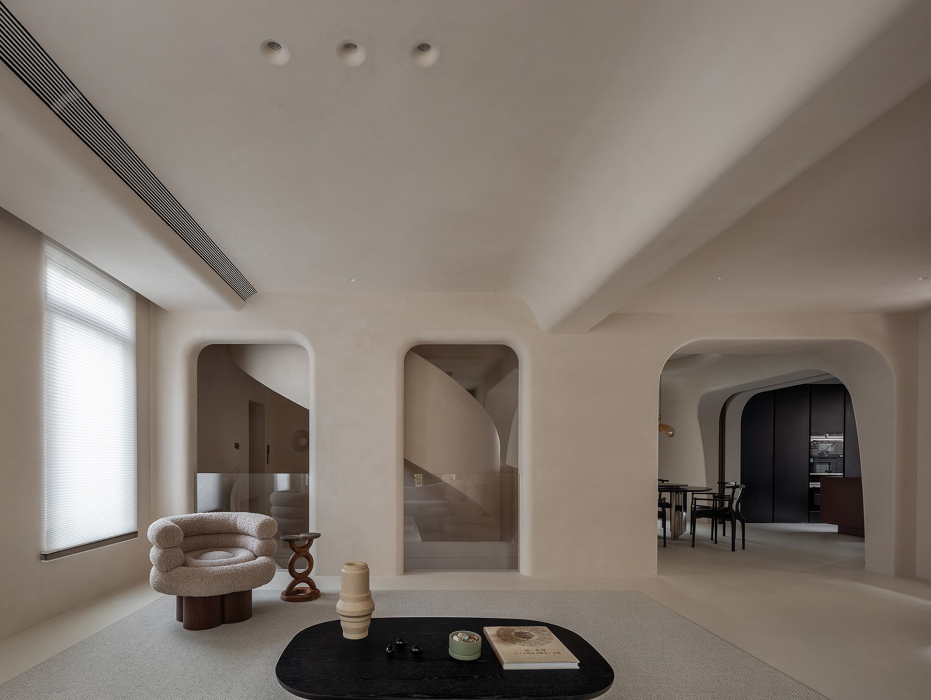 Modern living room with neutral tones and minimalist design.