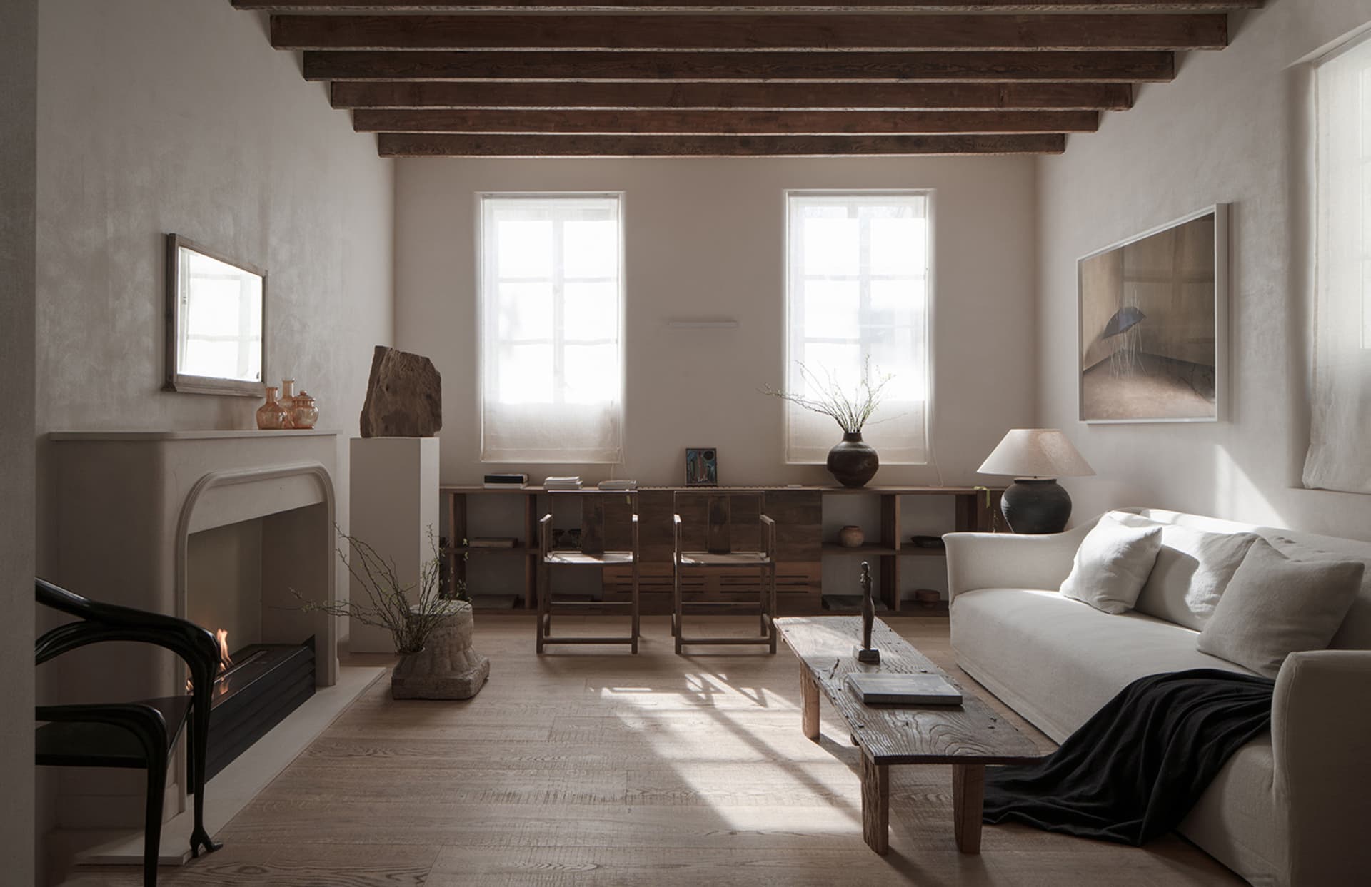 Modern Scandinavian living room with minimalist furniture, wooden floors, and natural light.