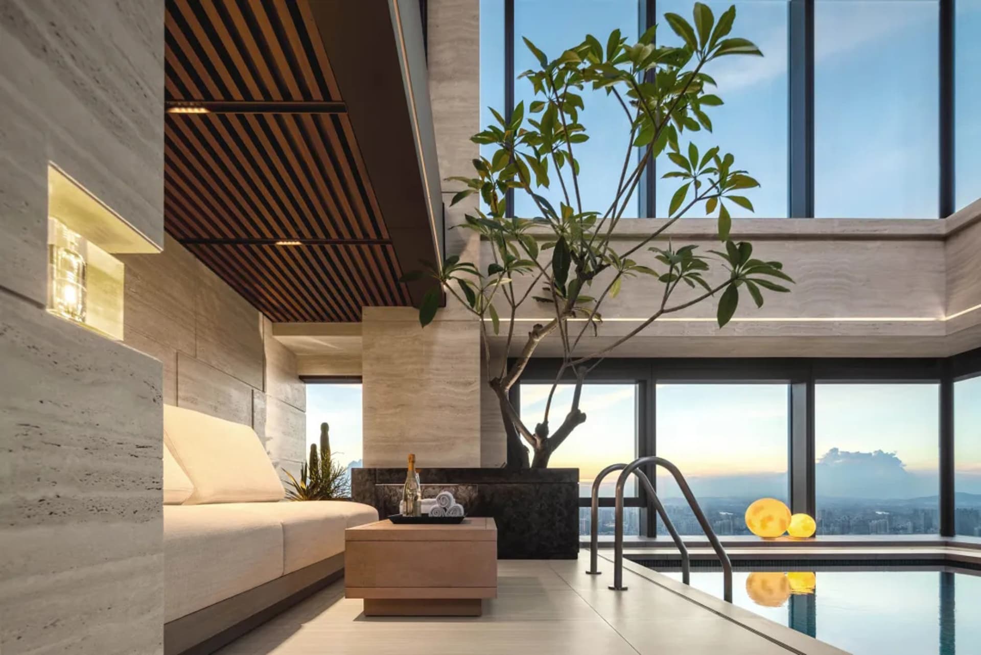 Modern spa with tile and concrete floors, glass walls, and a swimming pool.