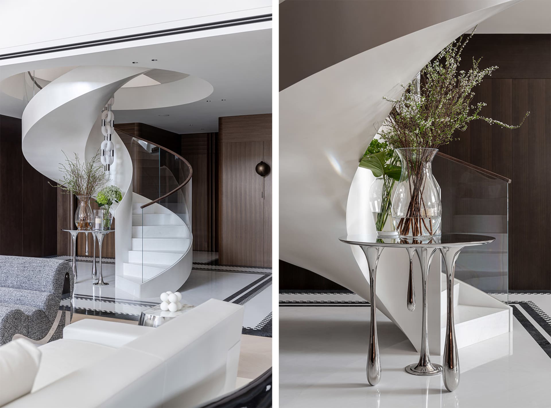 Modern living room featuring a glass staircase with metal railings and a white couch.