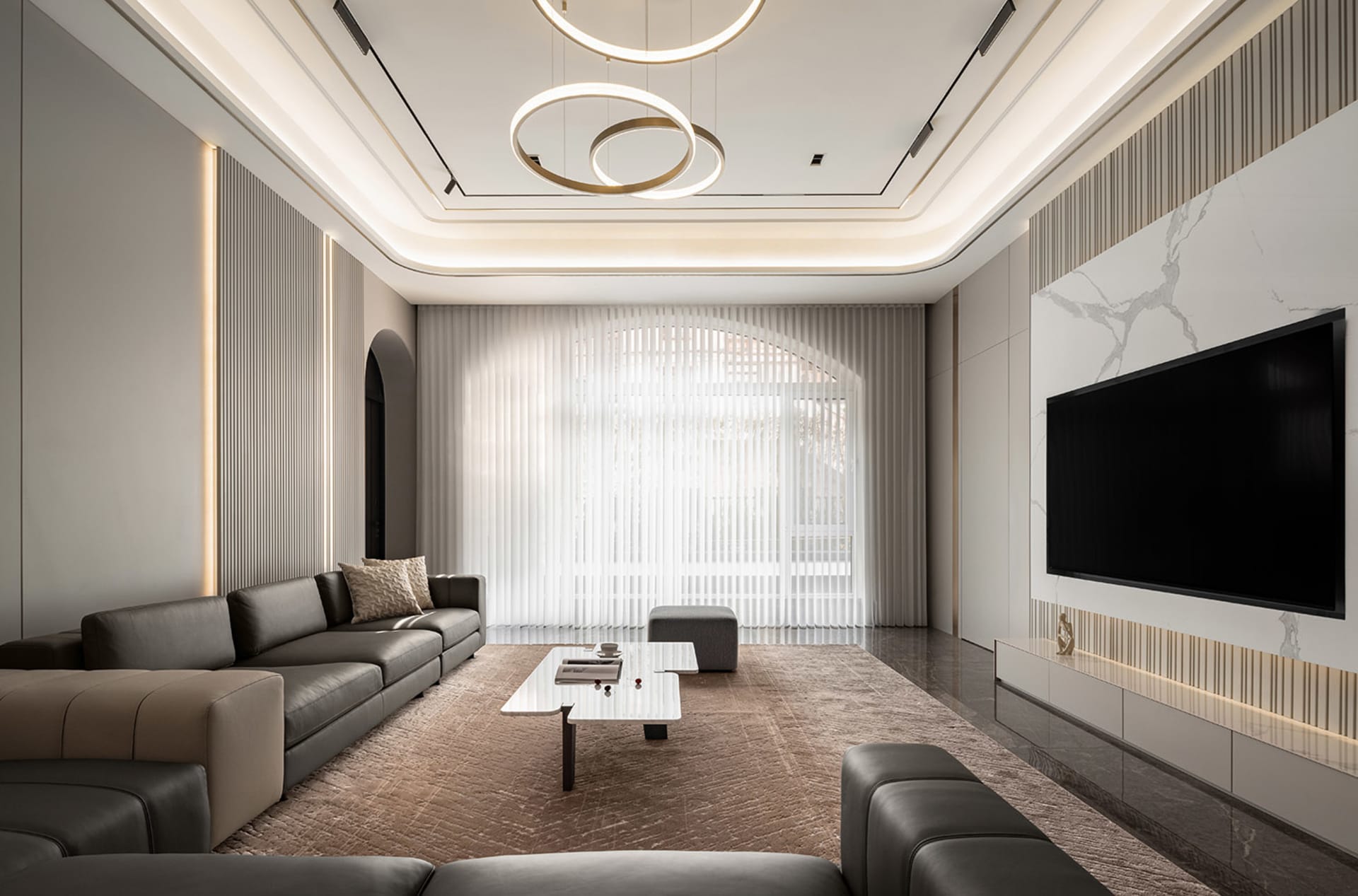 A modern living room featuring contemporary concrete surfaces, minimalistic design, and sleek furniture.