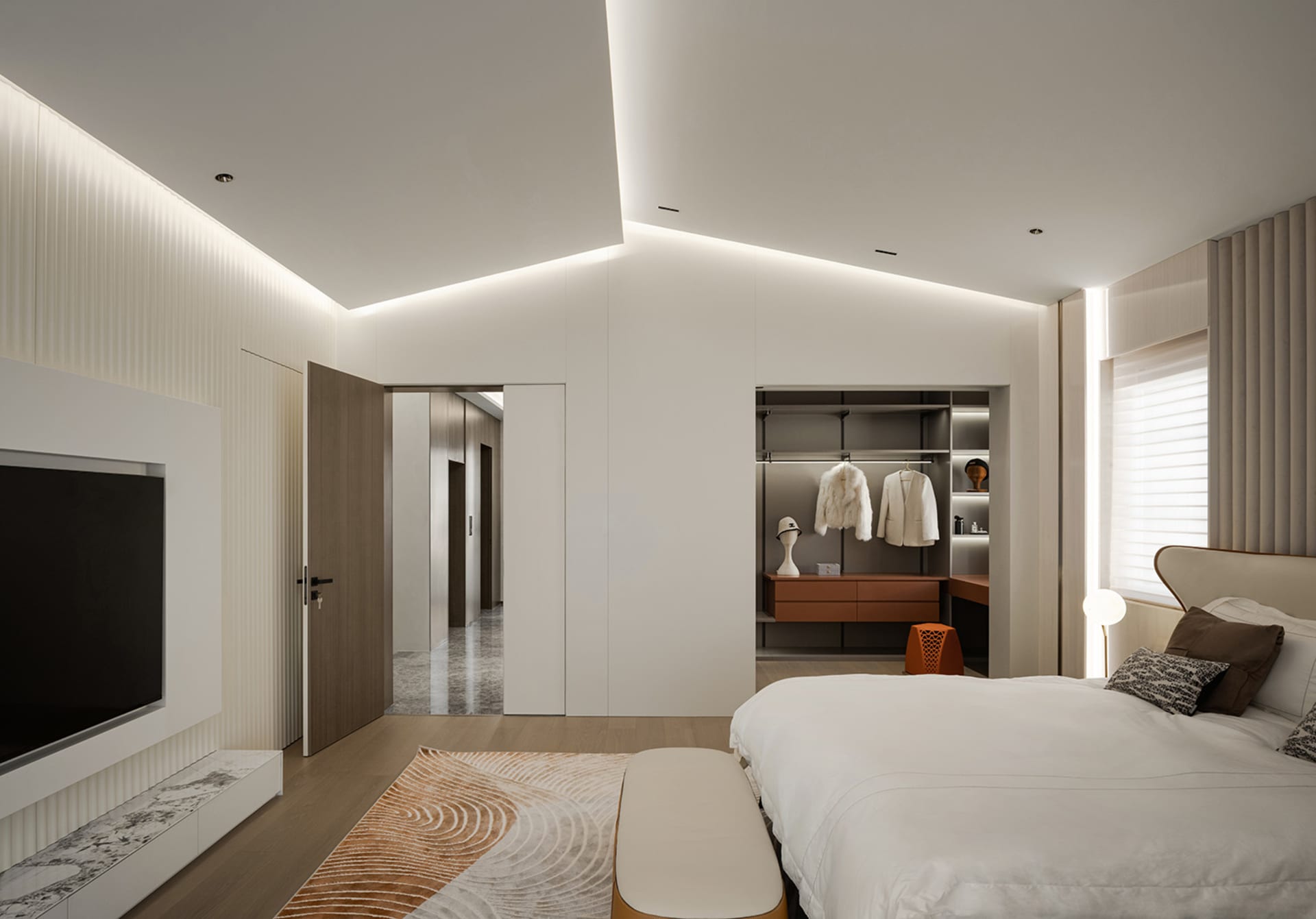 Spacious, minimalist bedroom with white walls, wooden floors, and marble accents.