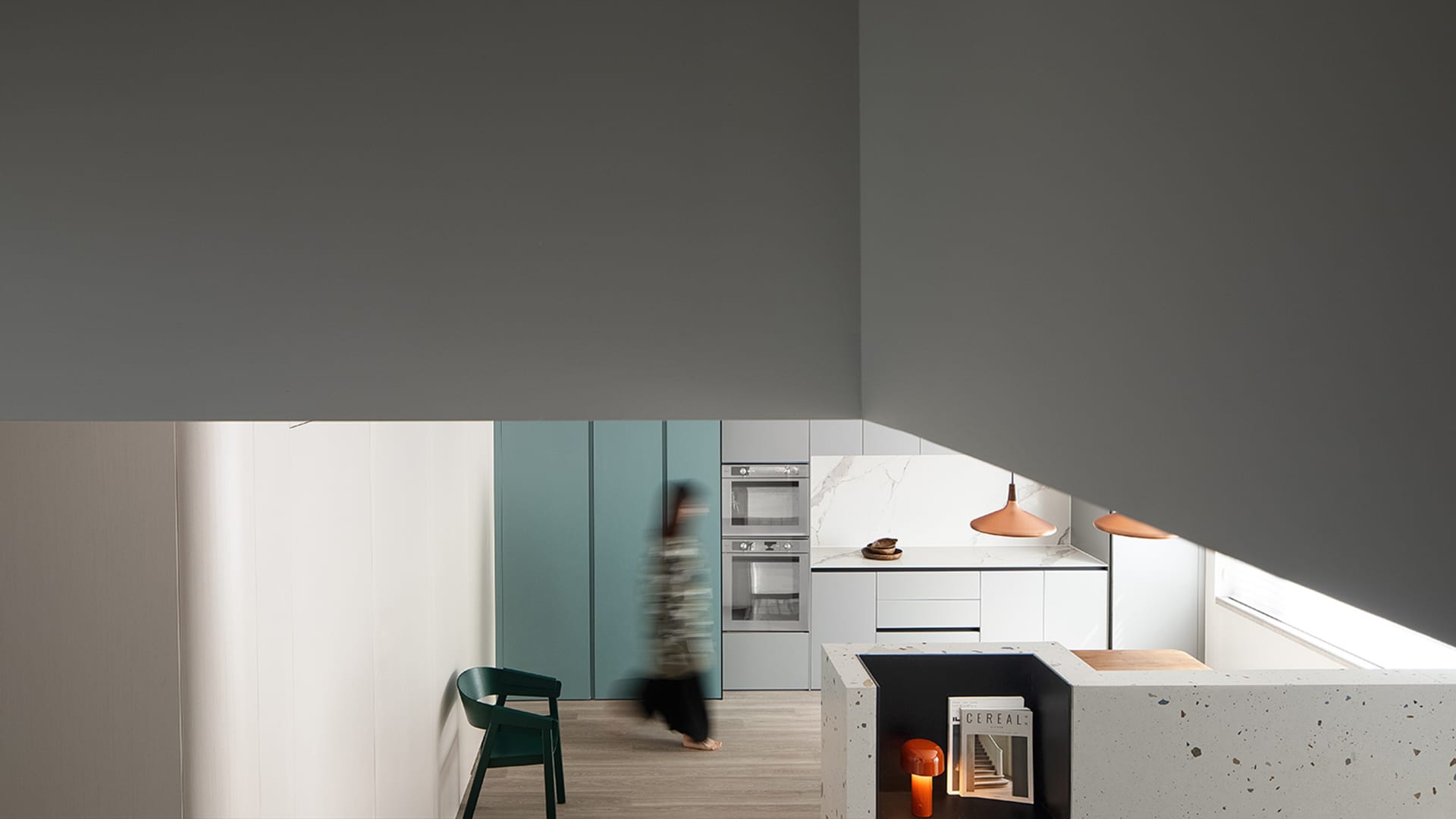 A modern residential kitchen with white marble cabinets, a minimalist design, and a sleek, contemporary feel.