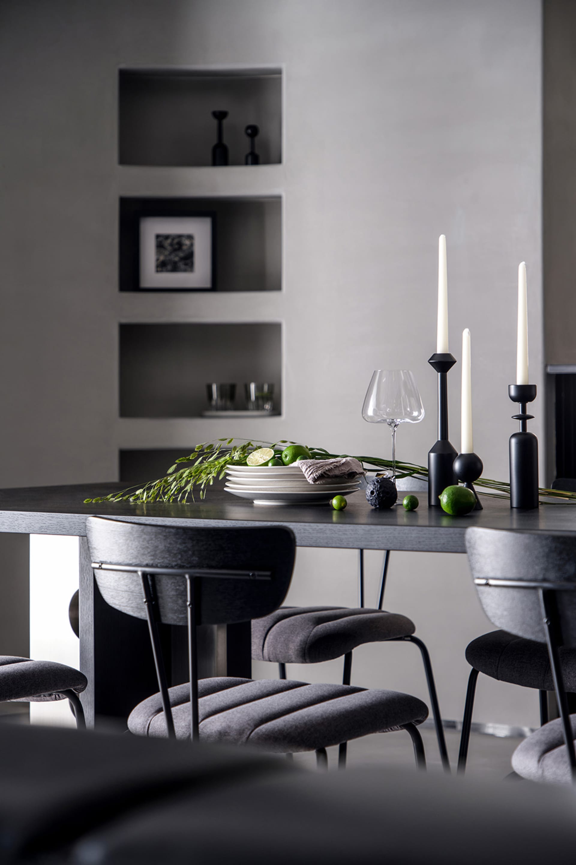 Modern dining room featuring ceramic and glass elements.